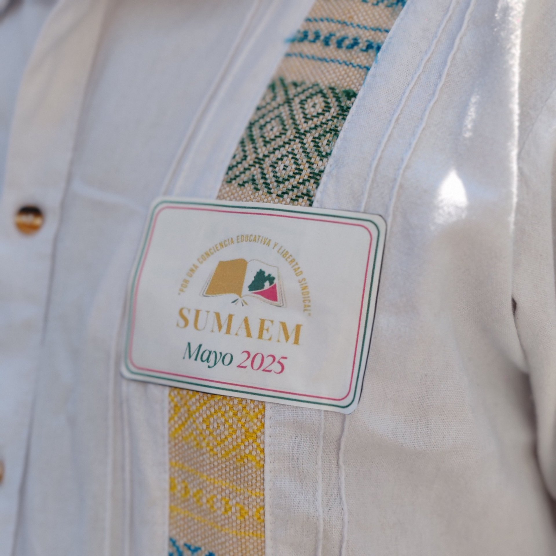 an abstract photo of a curved building with a blue sky in the background