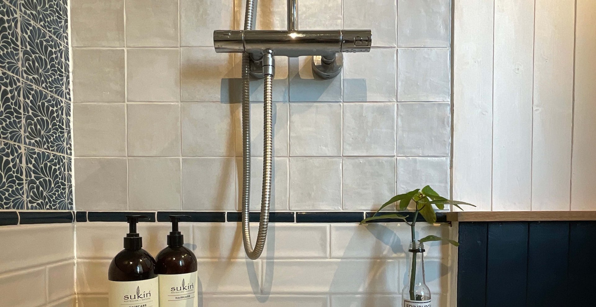 black and brown leather padded tub sofa