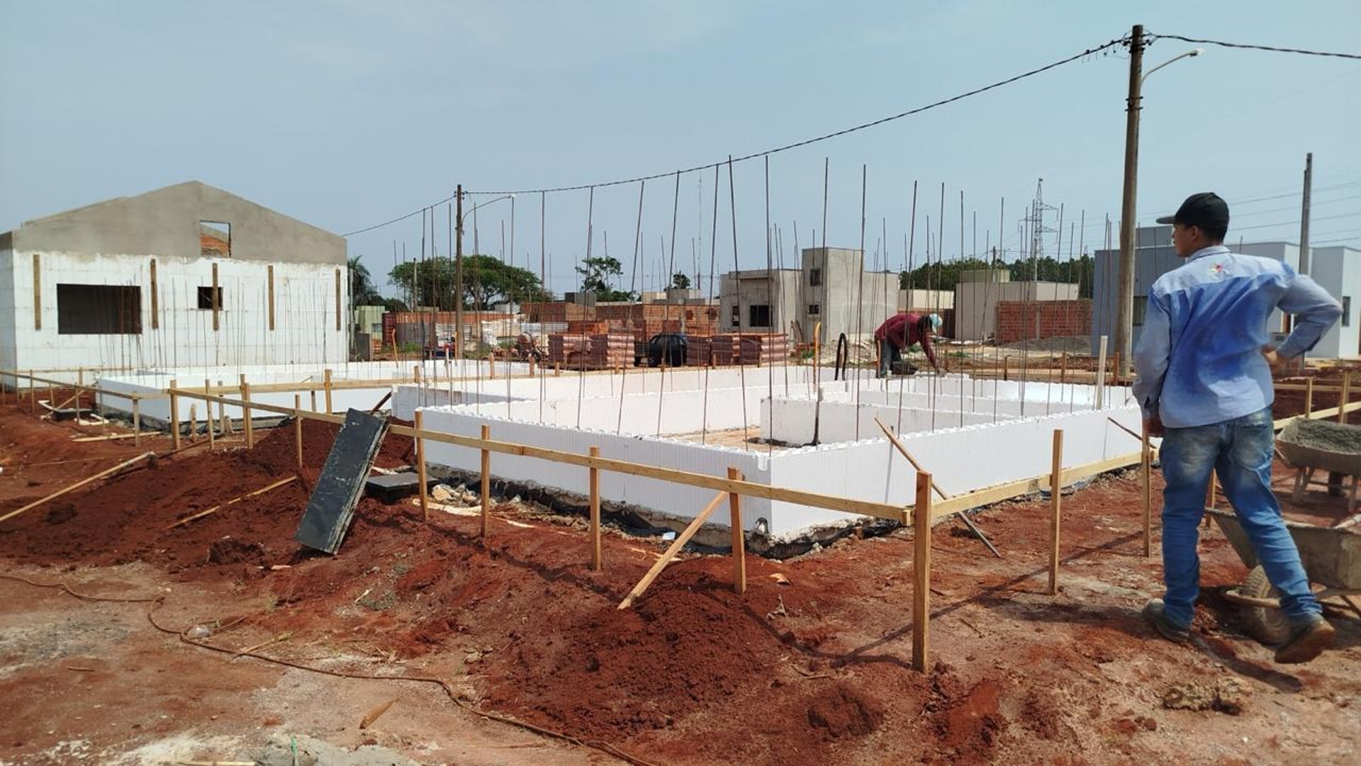 woman wearing yellow long-sleeved dress under white clouds and blue sky during daytime