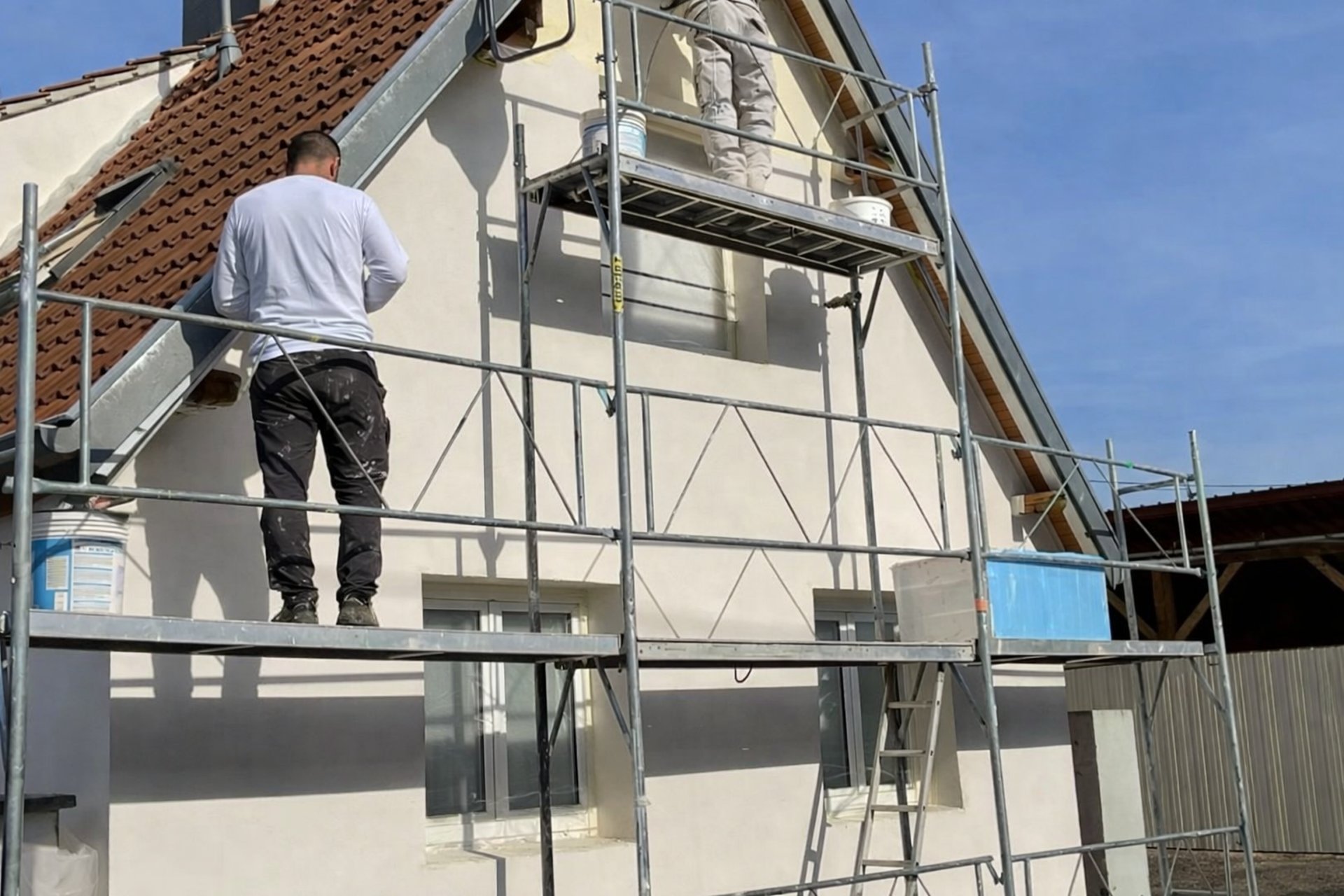 an abstract photo of a curved building with a blue sky in the background