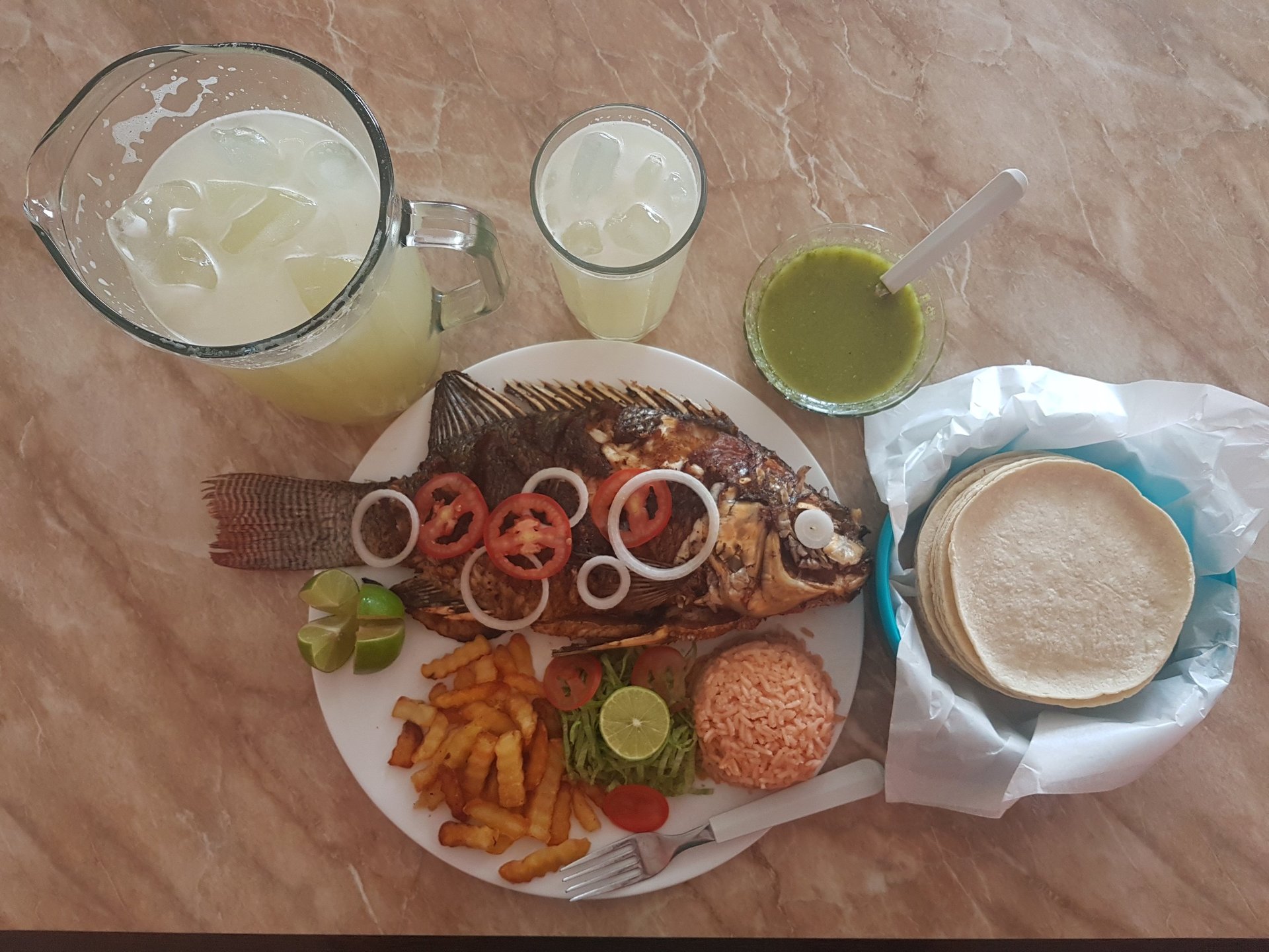 an abstract photo of a curved building with a blue sky in the background