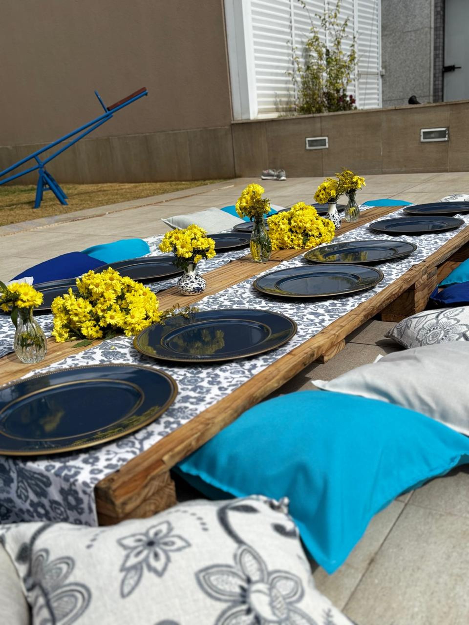 woman wearing yellow long-sleeved dress under white clouds and blue sky during daytime