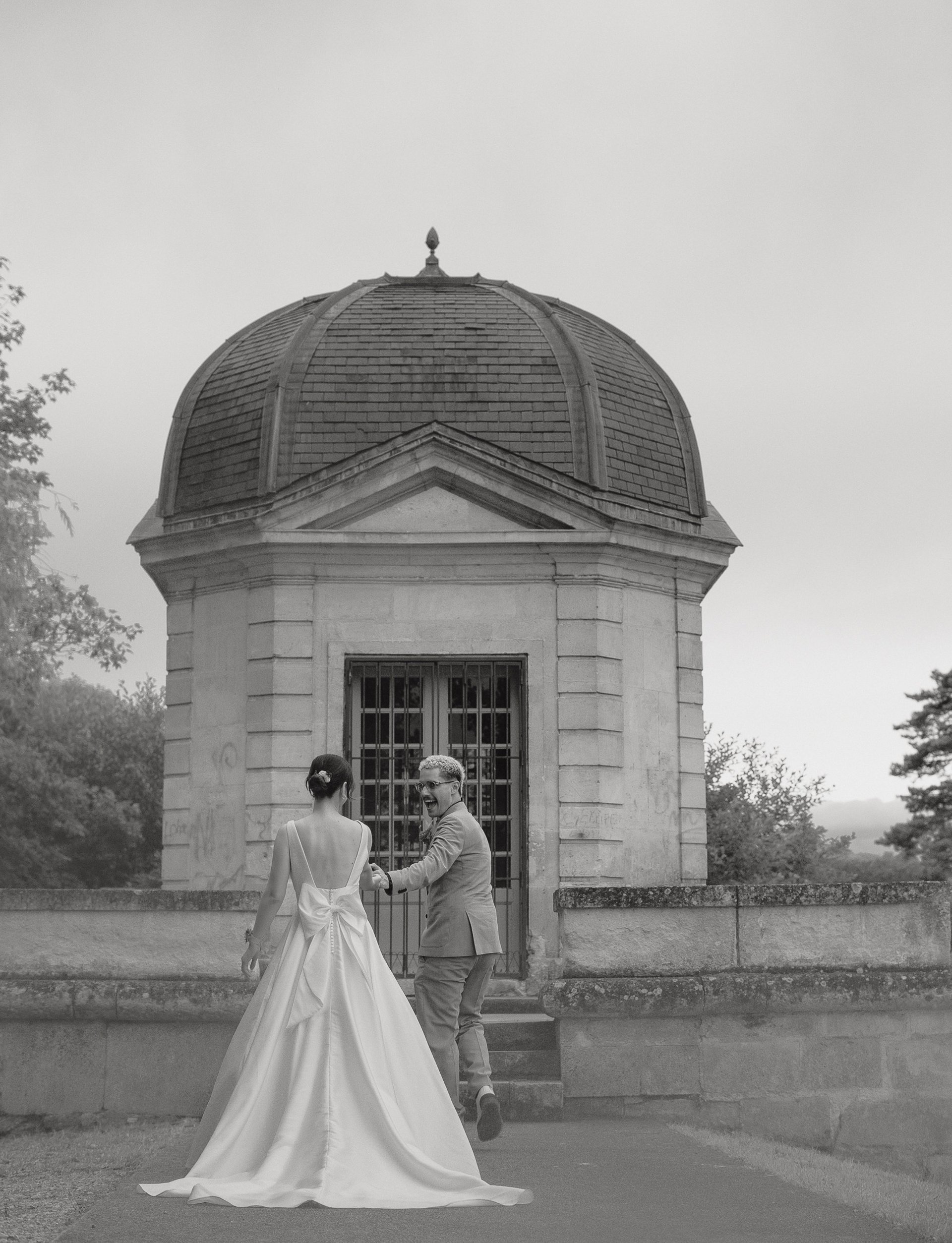 an abstract photo of a curved building with a blue sky in the background