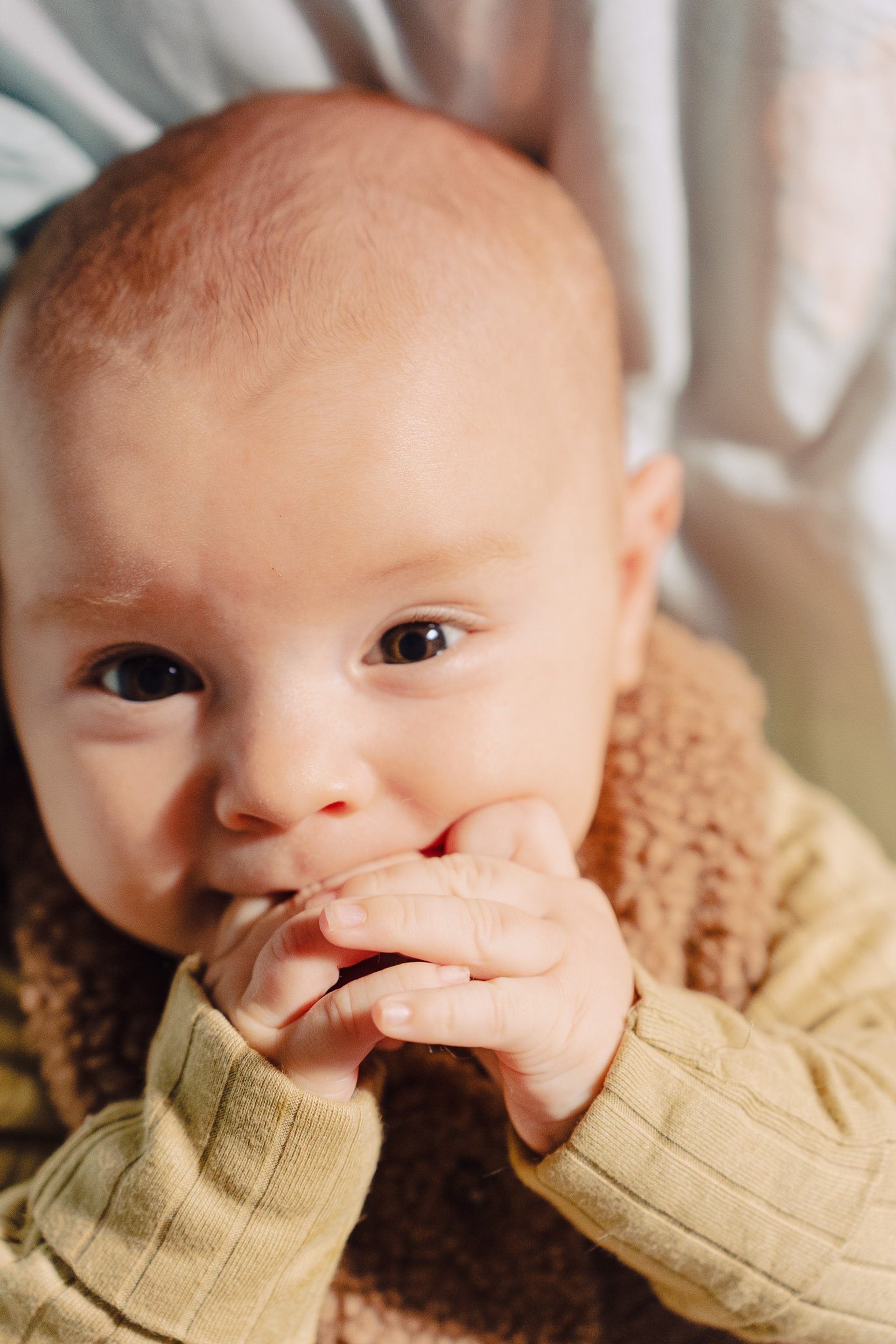 an abstract photo of a curved building with a blue sky in the background