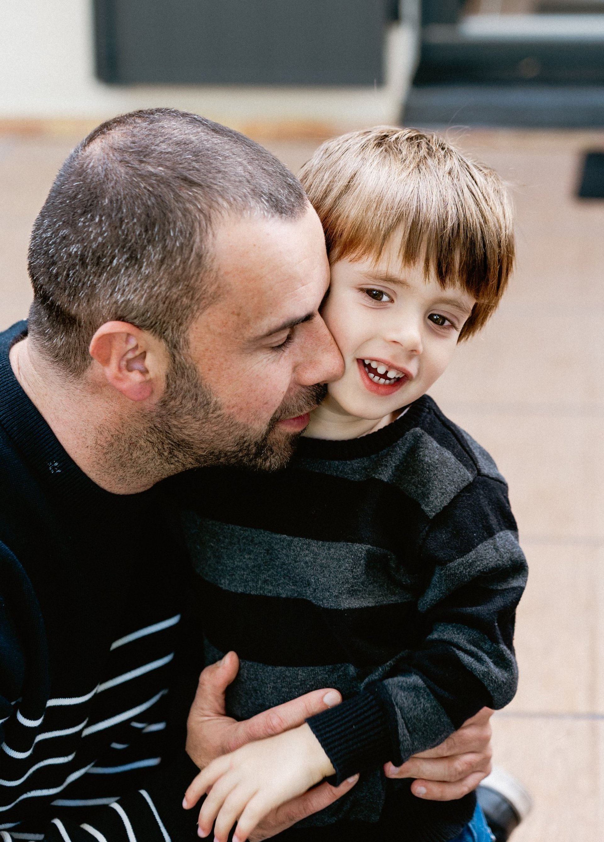 an abstract photo of a curved building with a blue sky in the background