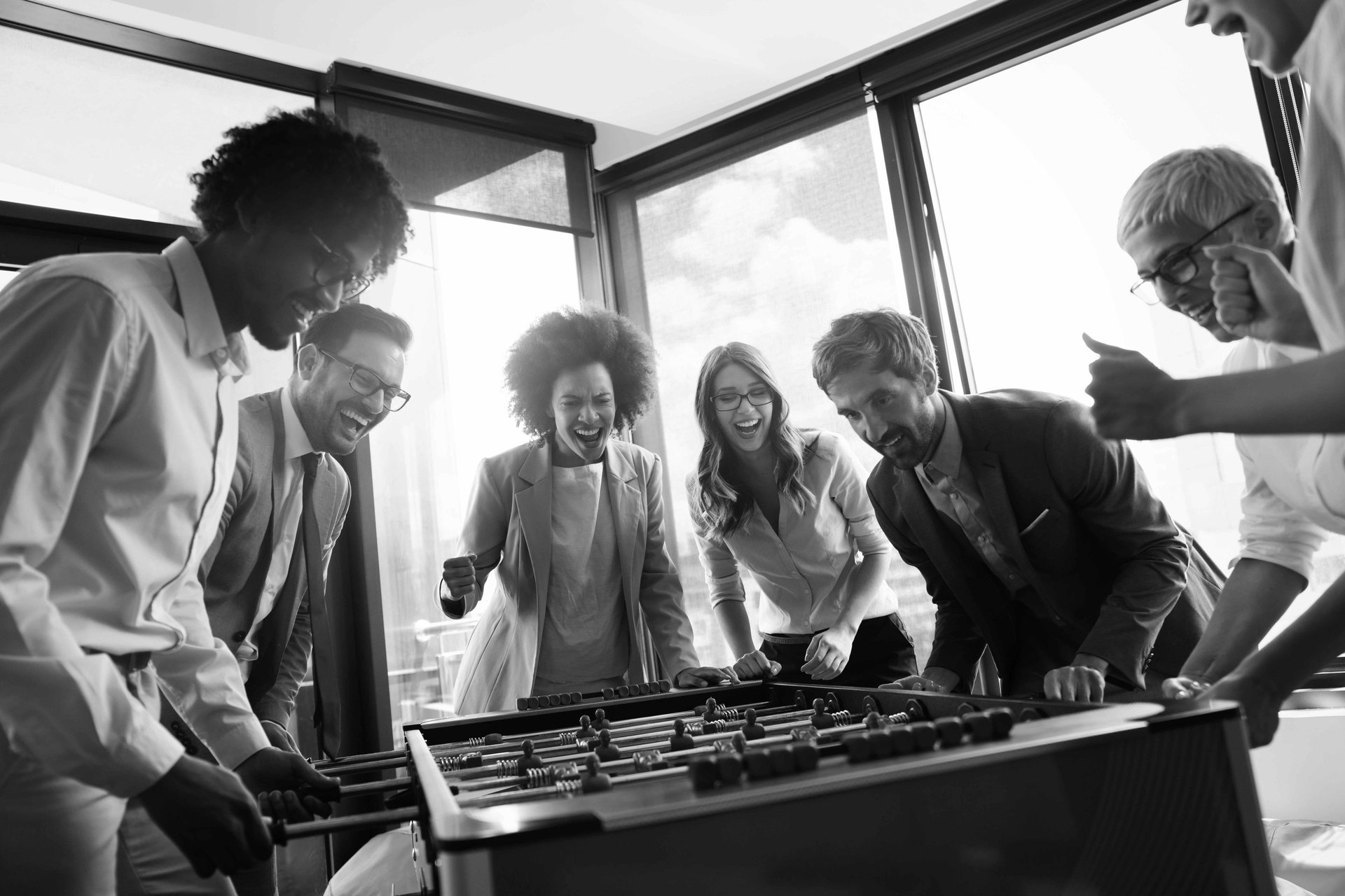 Diverse group of colleagues celebrating success in office