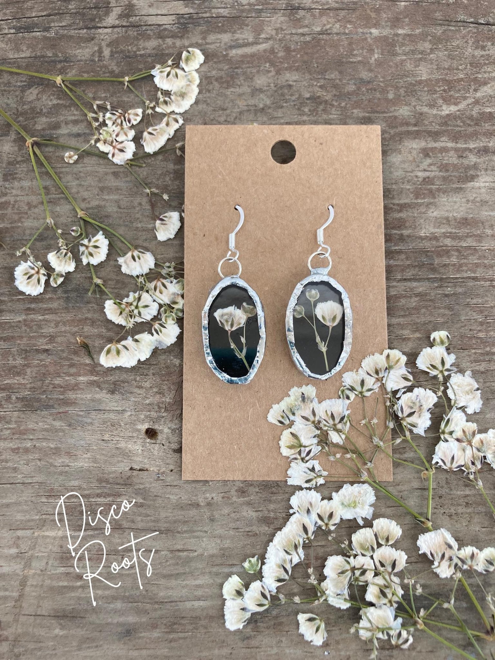 woman holding dried flower