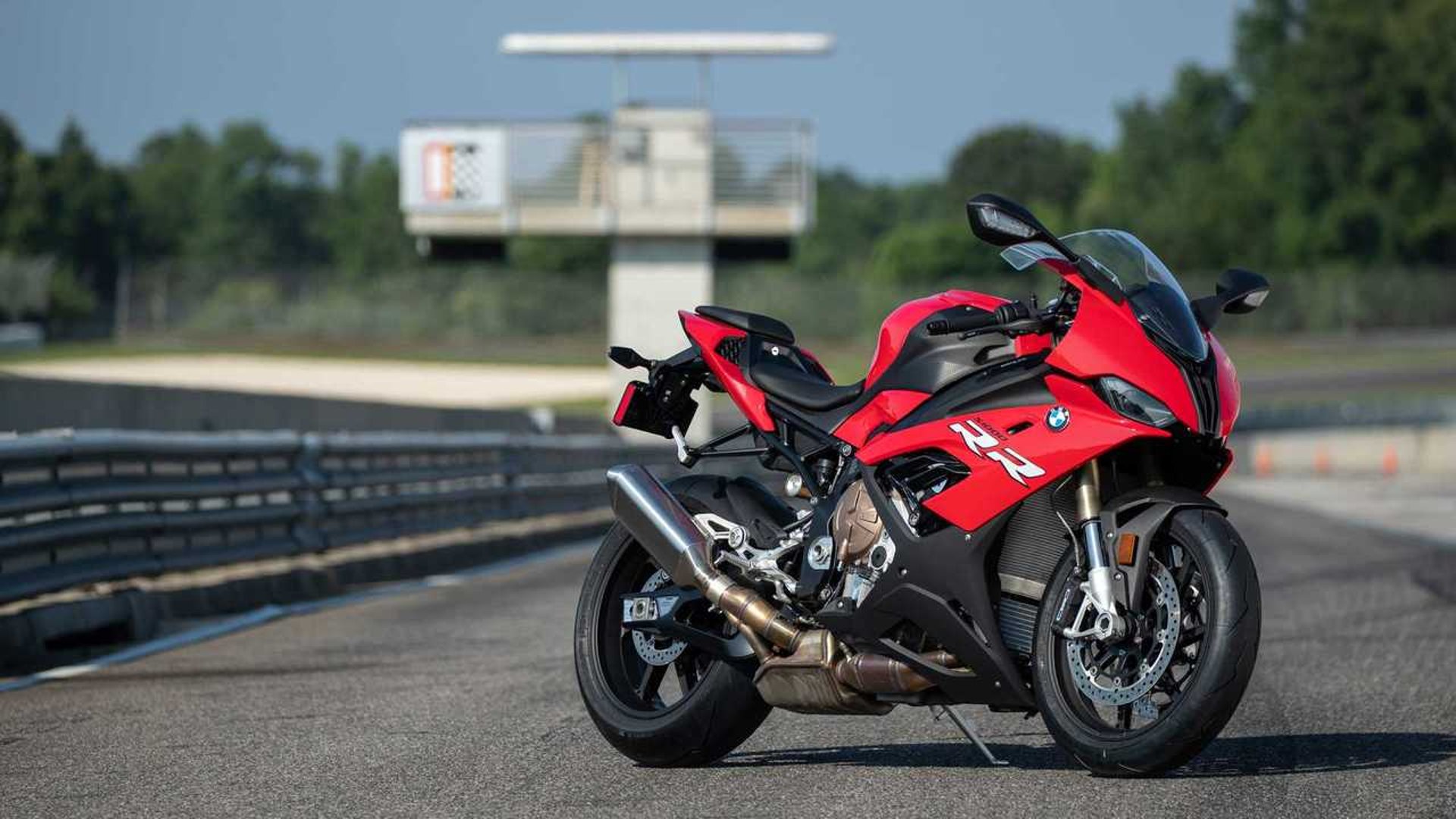 an abstract photo of a curved building with a blue sky in the background