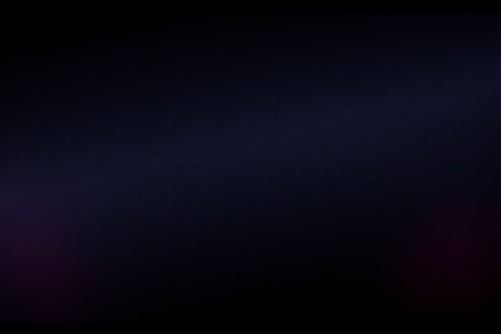 an abstract photo of a curved building with a blue sky in the background