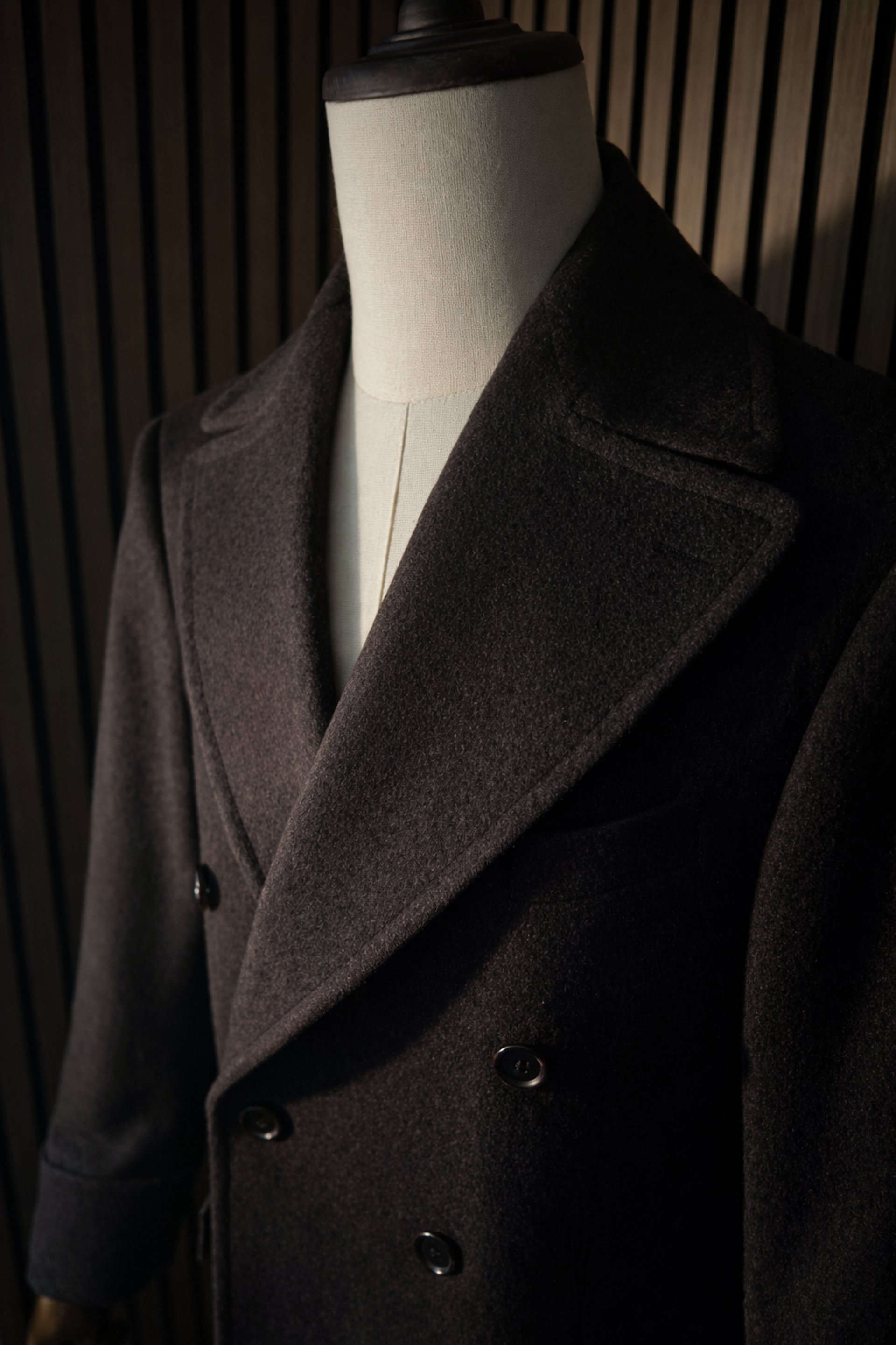 an abstract photo of a curved building with a blue sky in the background