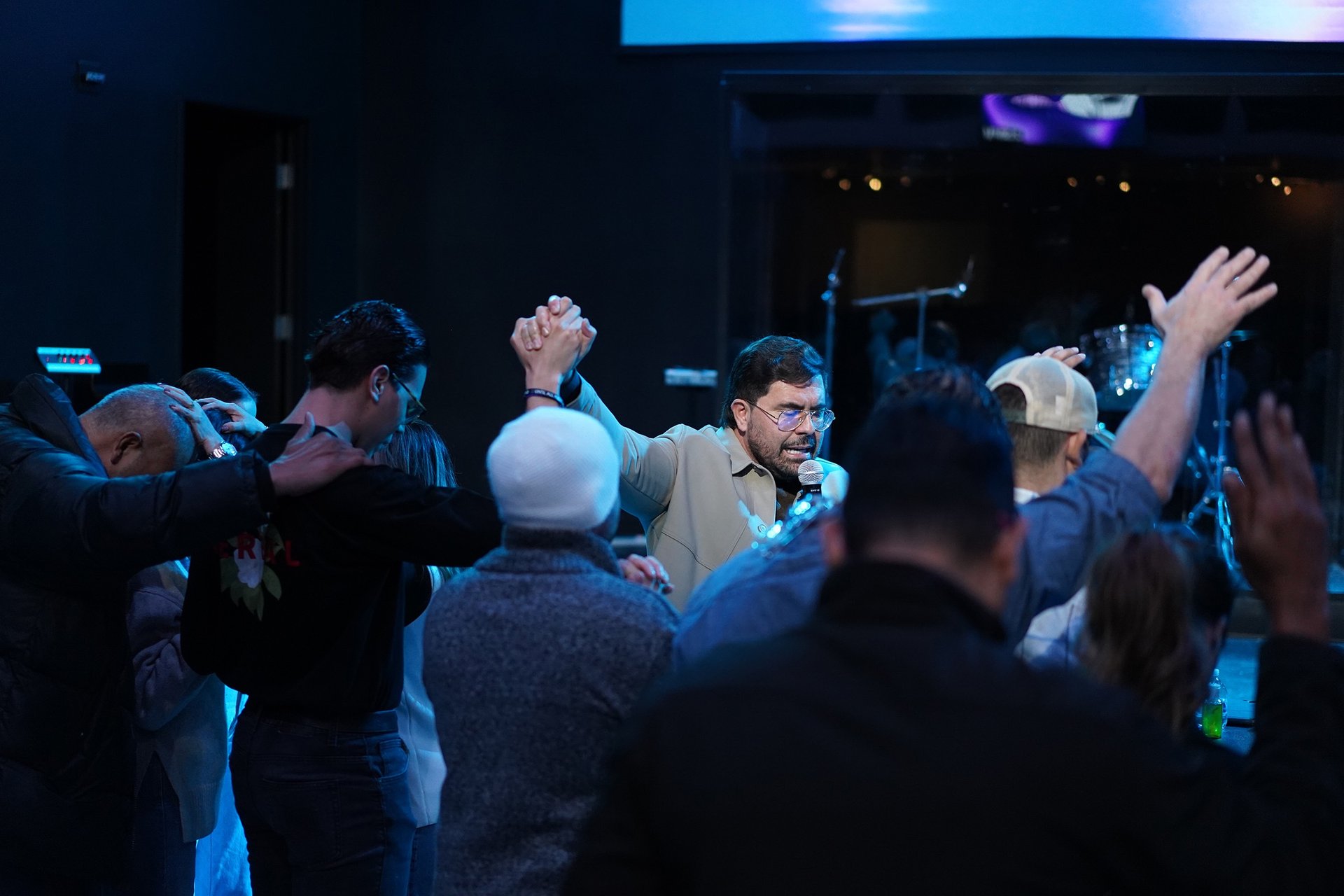 an abstract photo of a curved building with a blue sky in the background