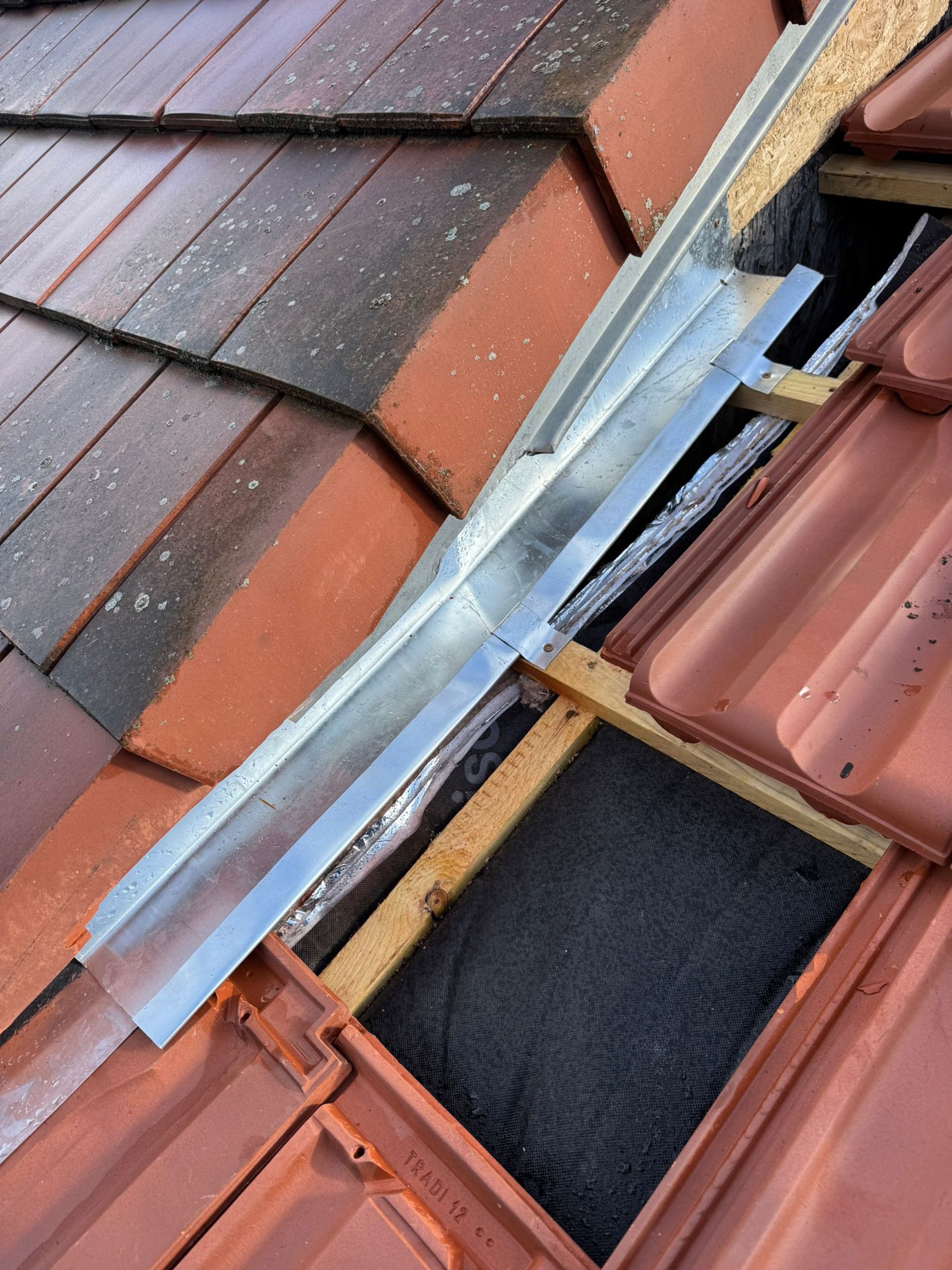 a person wearing blue gloves and holding a hammer