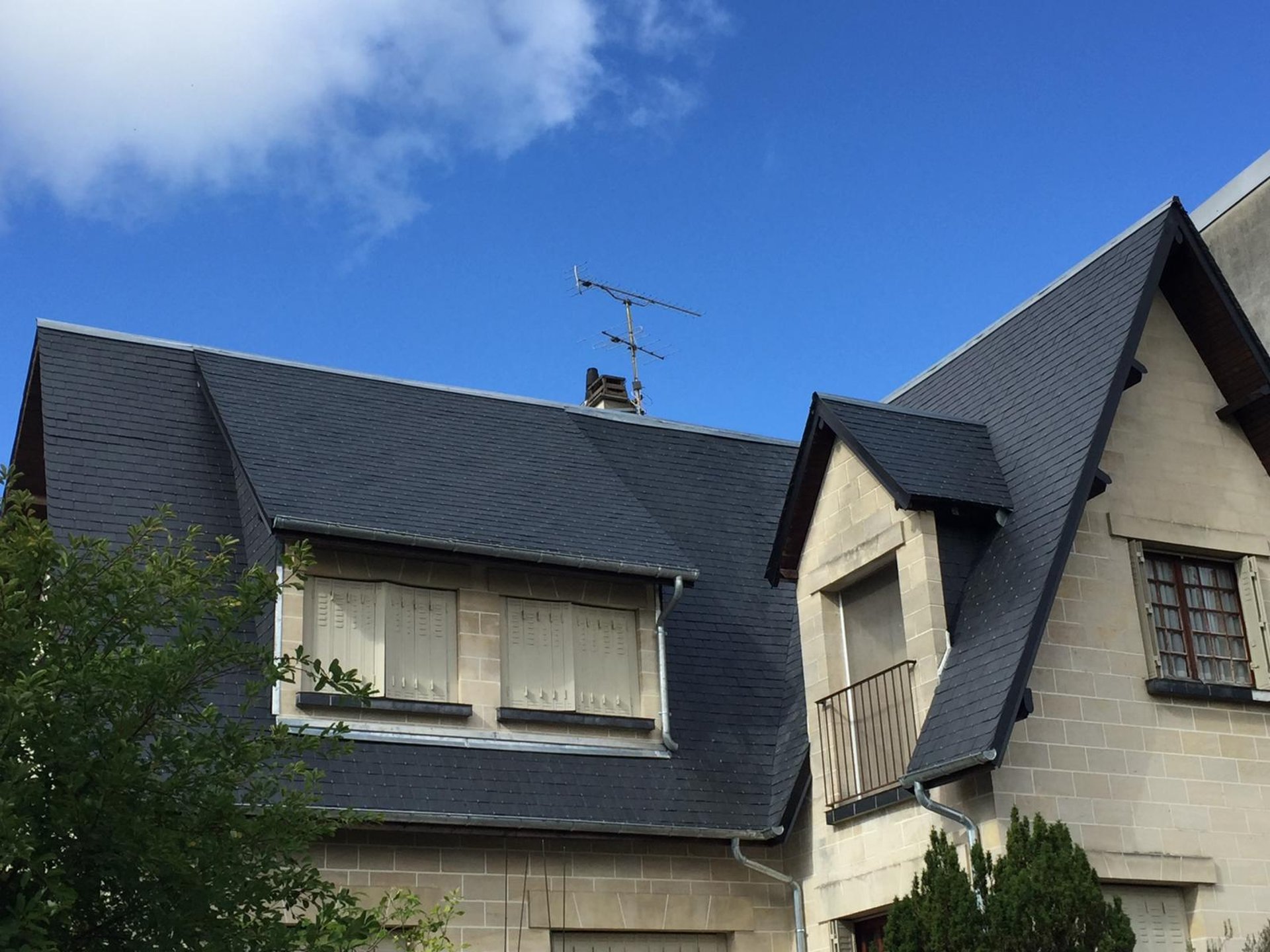 a person wearing blue gloves and holding a hammer