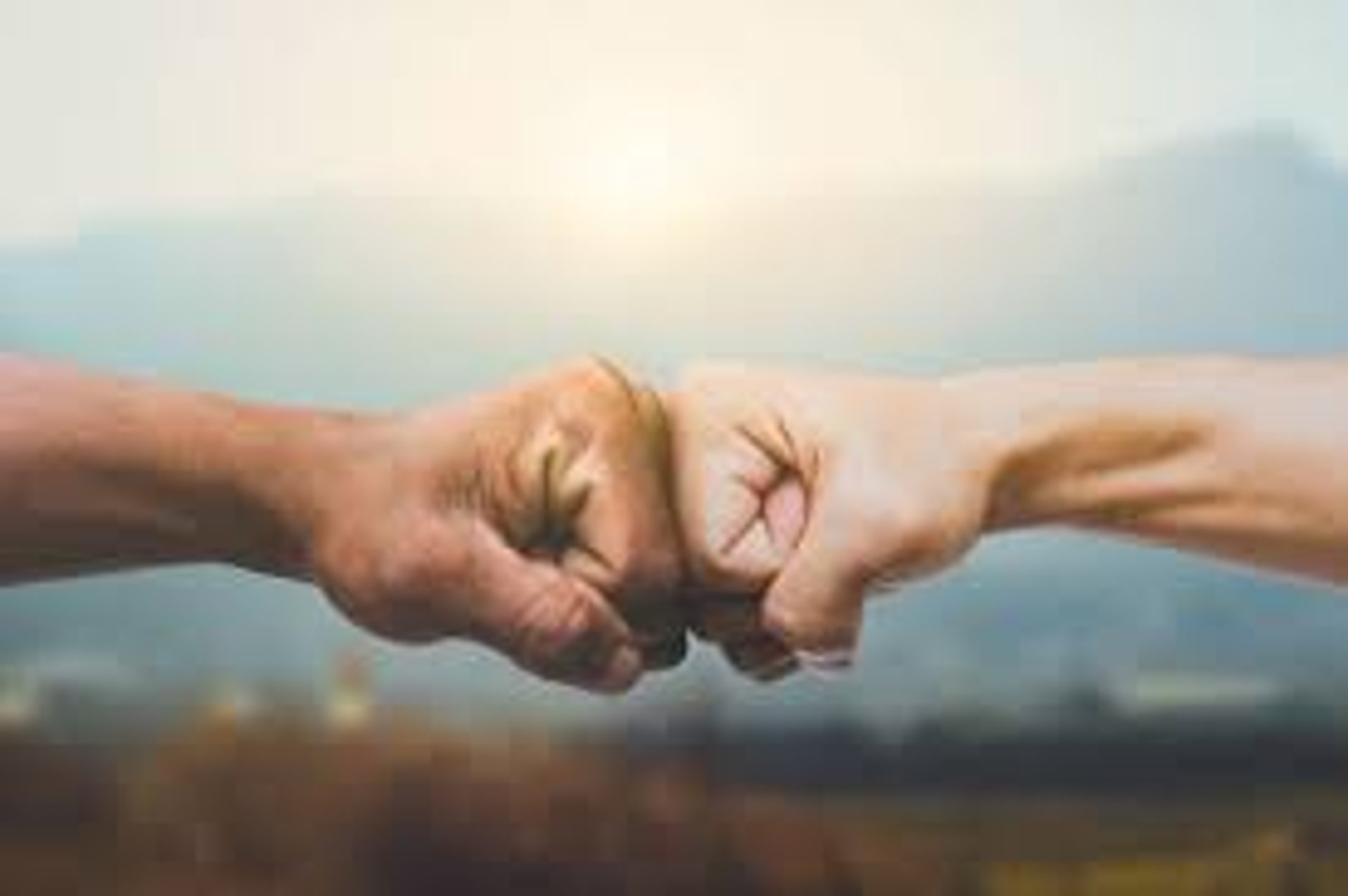 an abstract photo of a curved building with a blue sky in the background