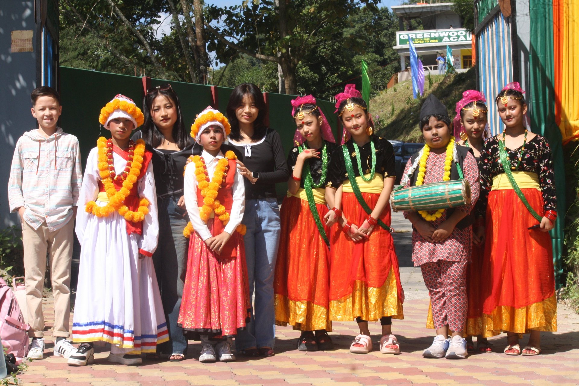 man in blue and white striped polo shirt standing beside woman in black shirt