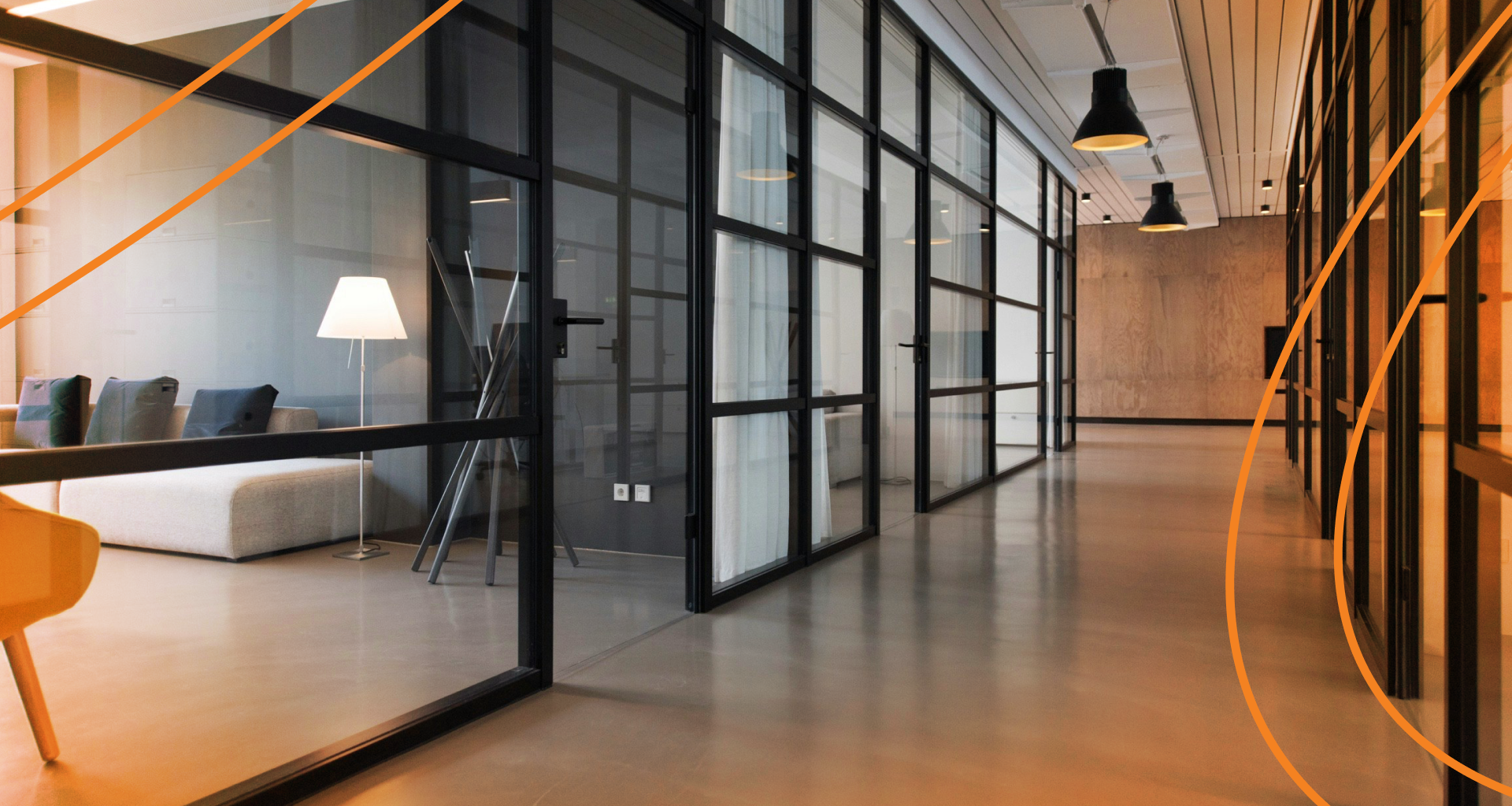 a room with a wood floor and large windows