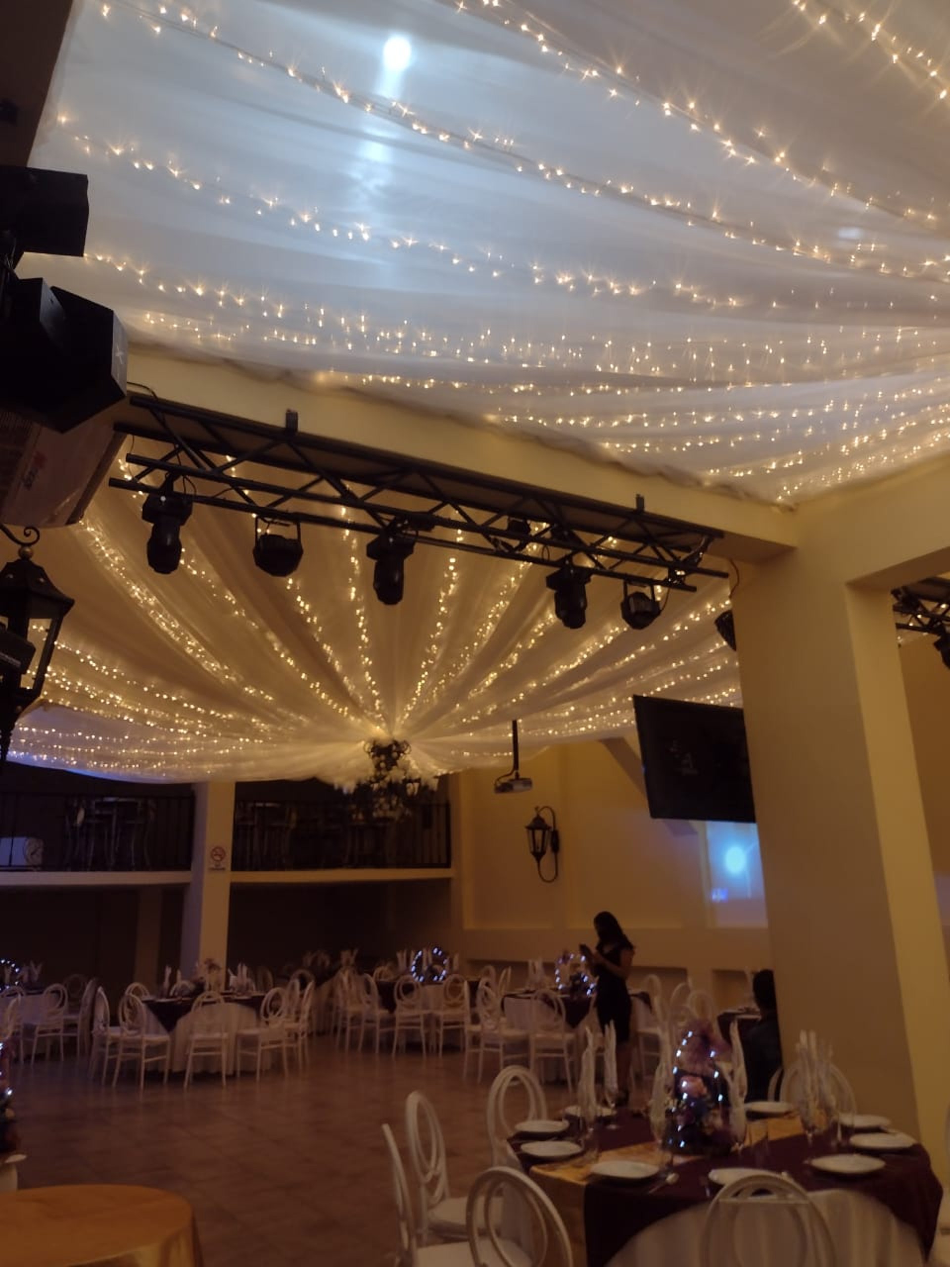 woman wearing yellow long-sleeved dress under white clouds and blue sky during daytime