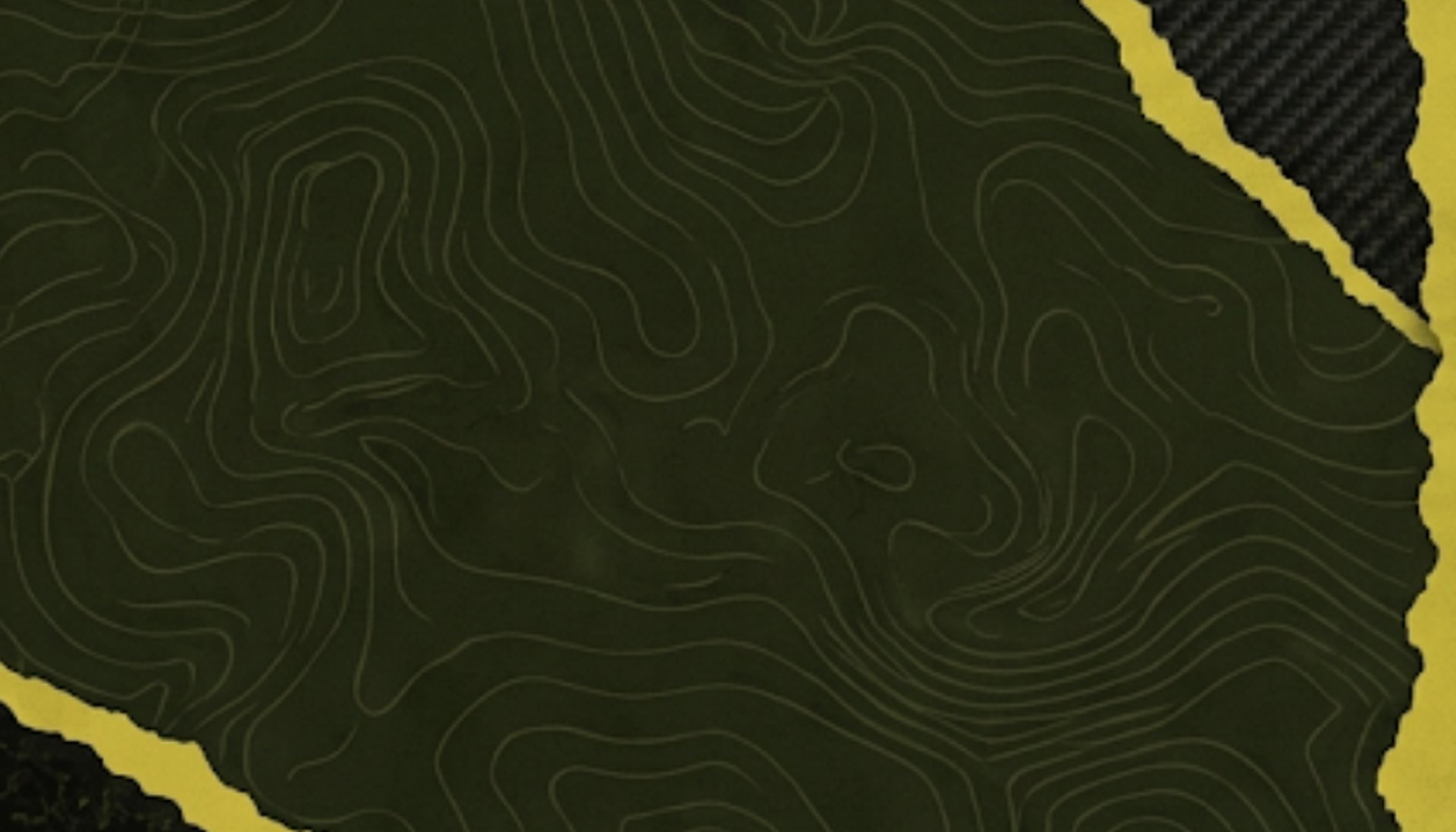 man holding bike while standing on gray mountain