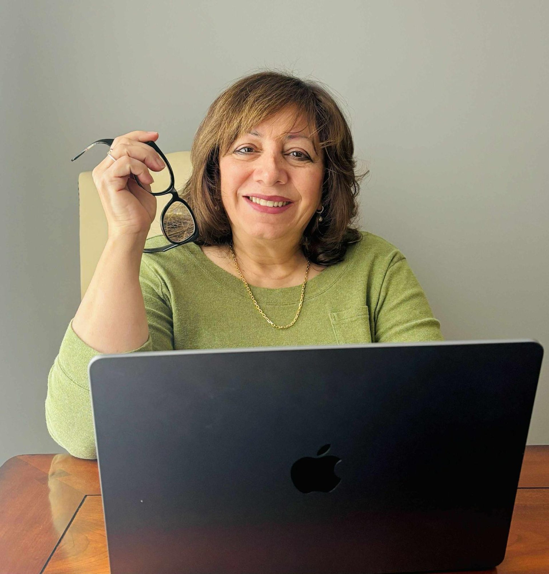 an abstract photo of a curved building with a blue sky in the background