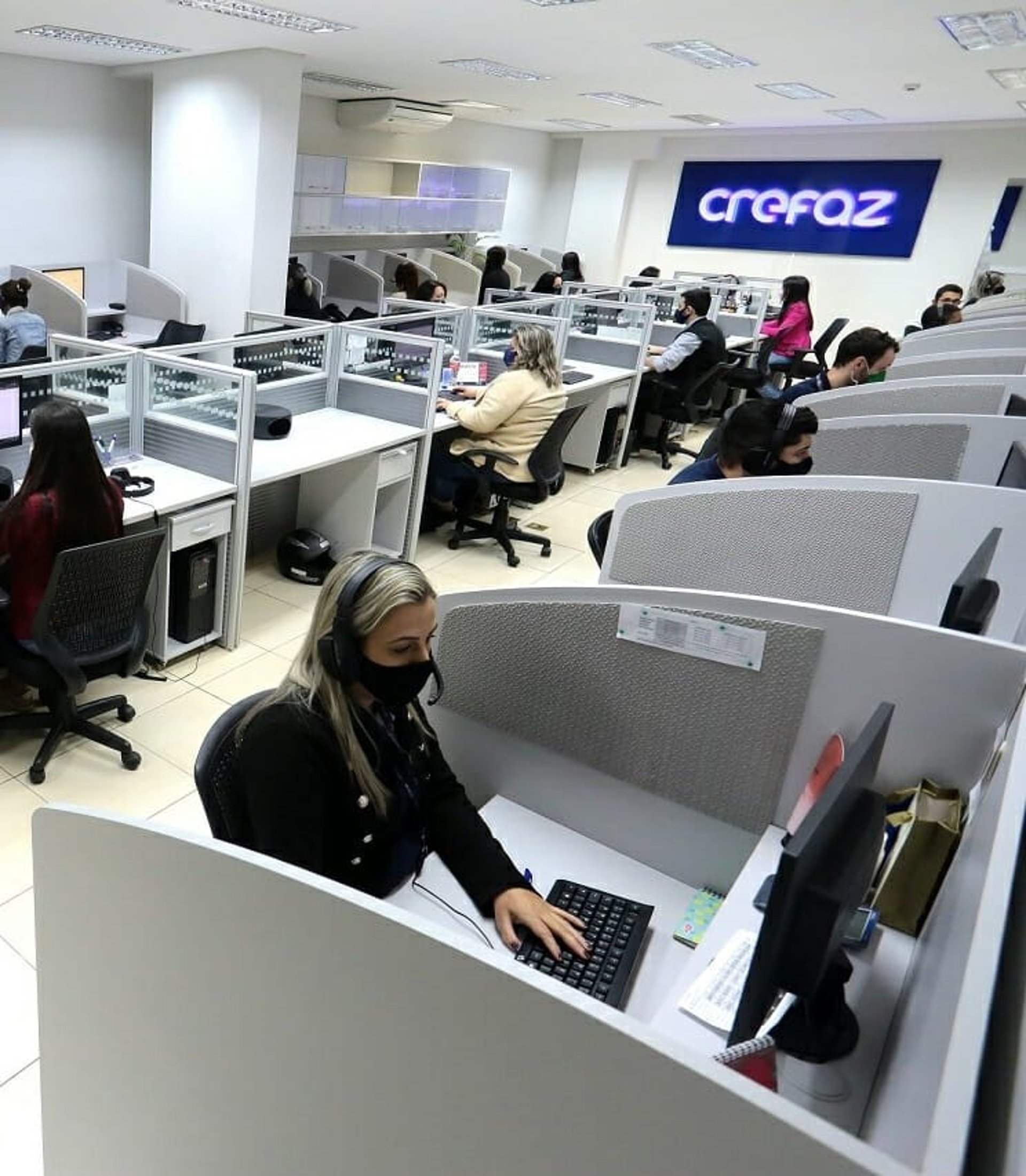 an abstract photo of a curved building with a blue sky in the background