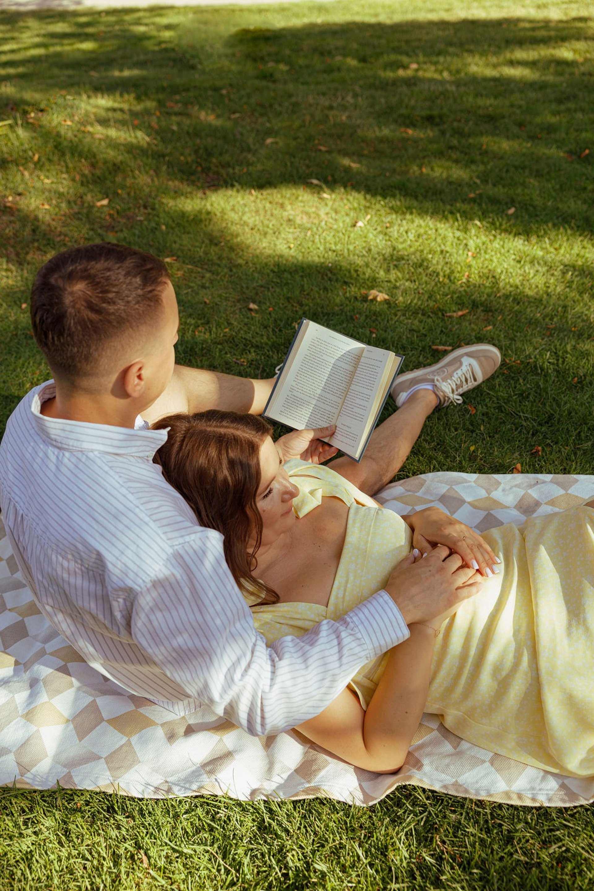 an abstract photo of a curved building with a blue sky in the background