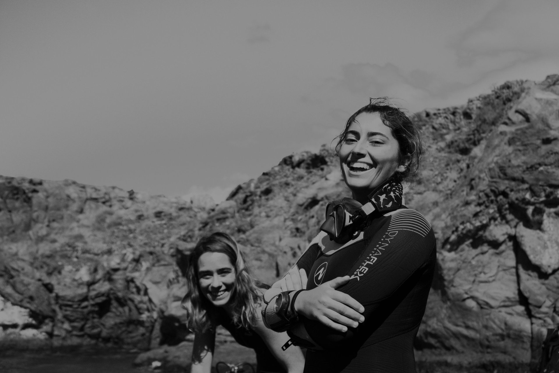 a cruise ship in the ocean with a rope in the foreground