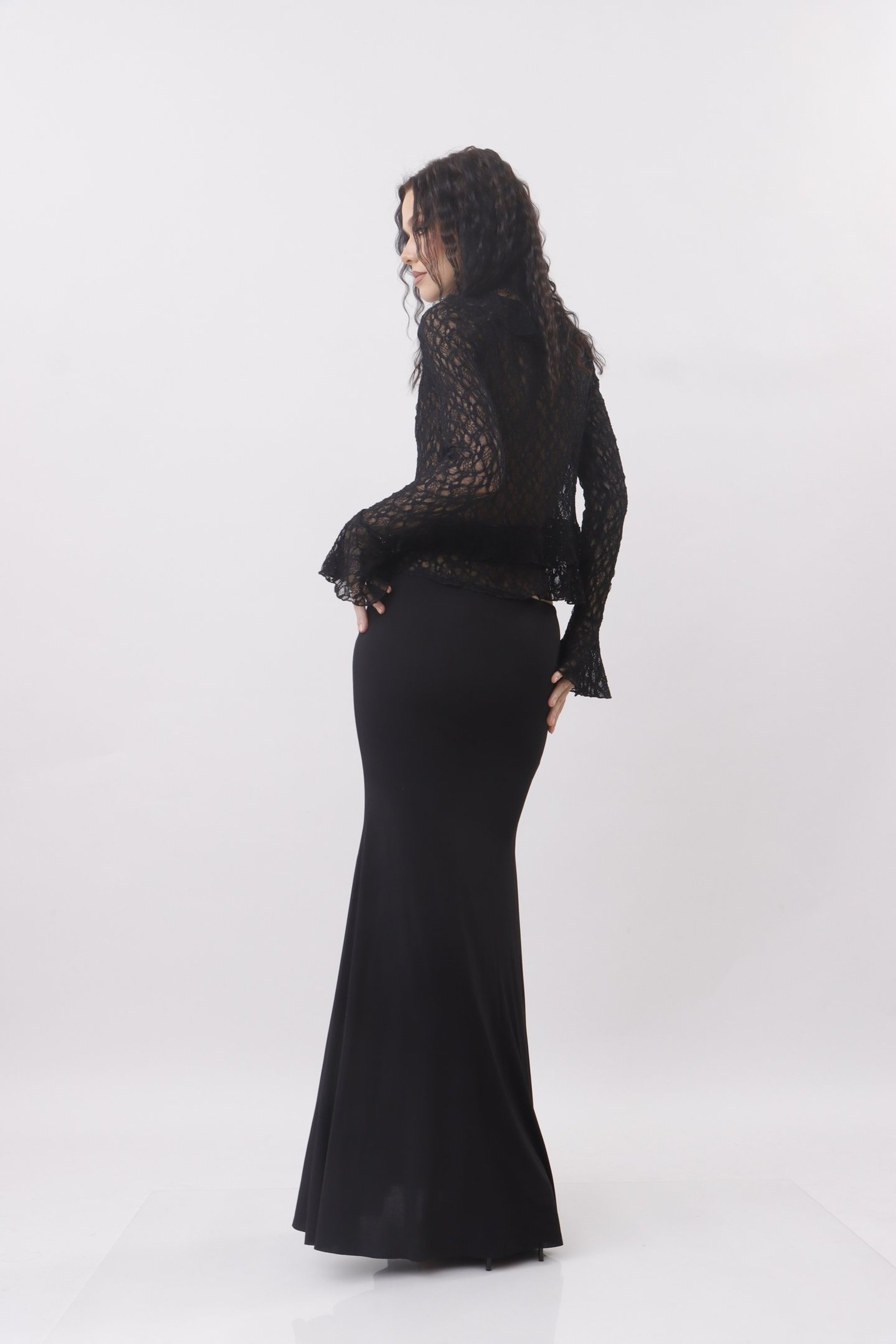 an abstract photo of a curved building with a blue sky in the background