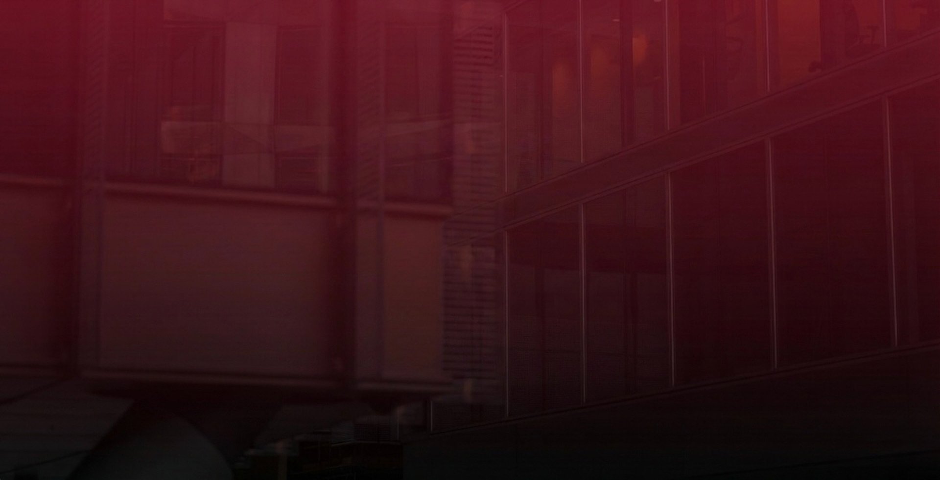 an abstract photo of a building with a red and blue light