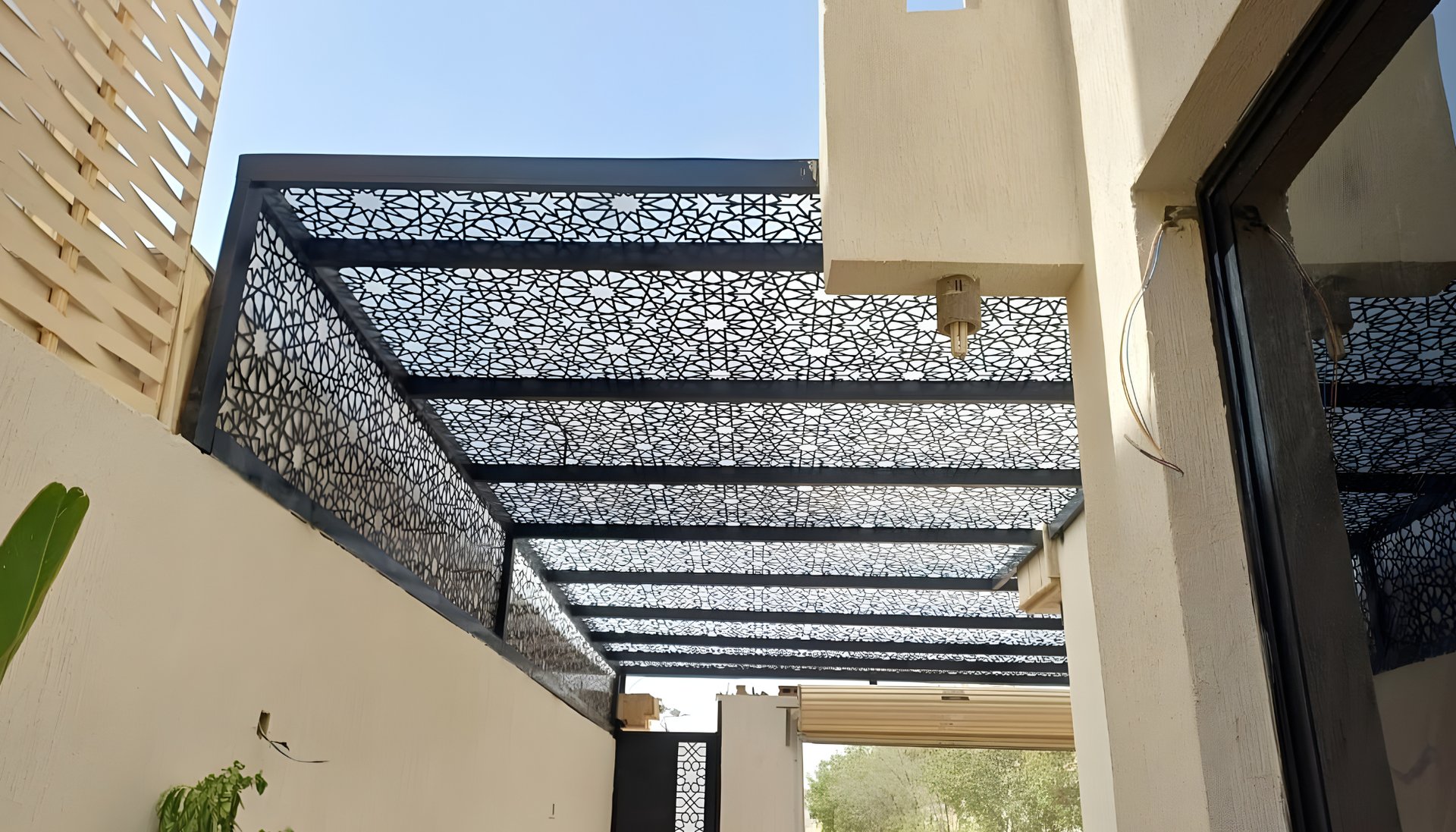 an abstract photo of a curved building with a blue sky in the background