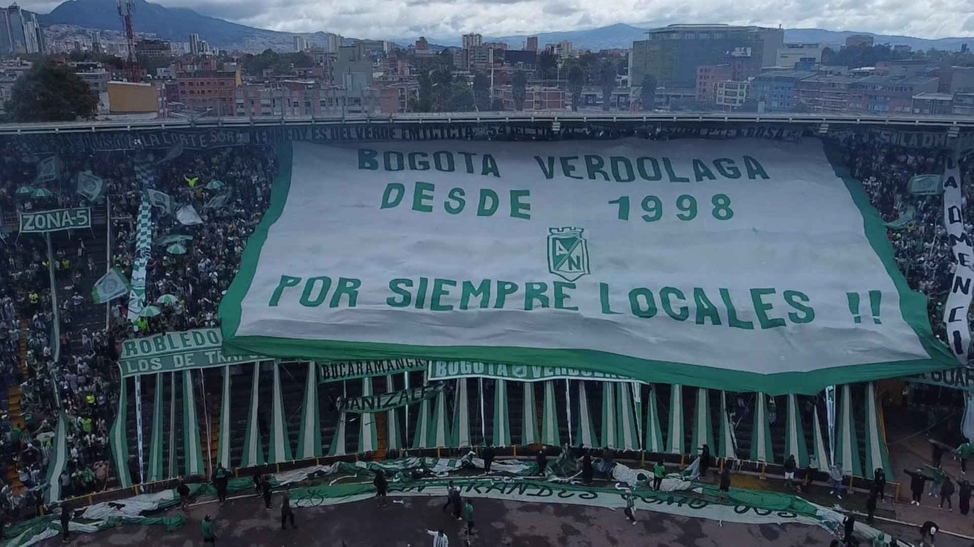 an abstract photo of a curved building with a blue sky in the background