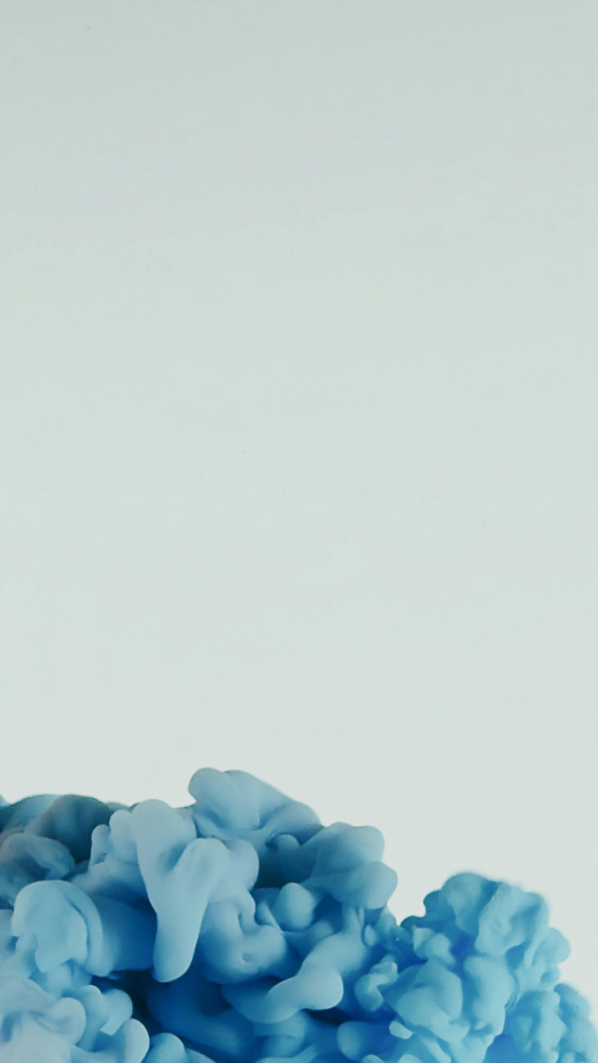 woman wearing yellow long-sleeved dress under white clouds and blue sky during daytime