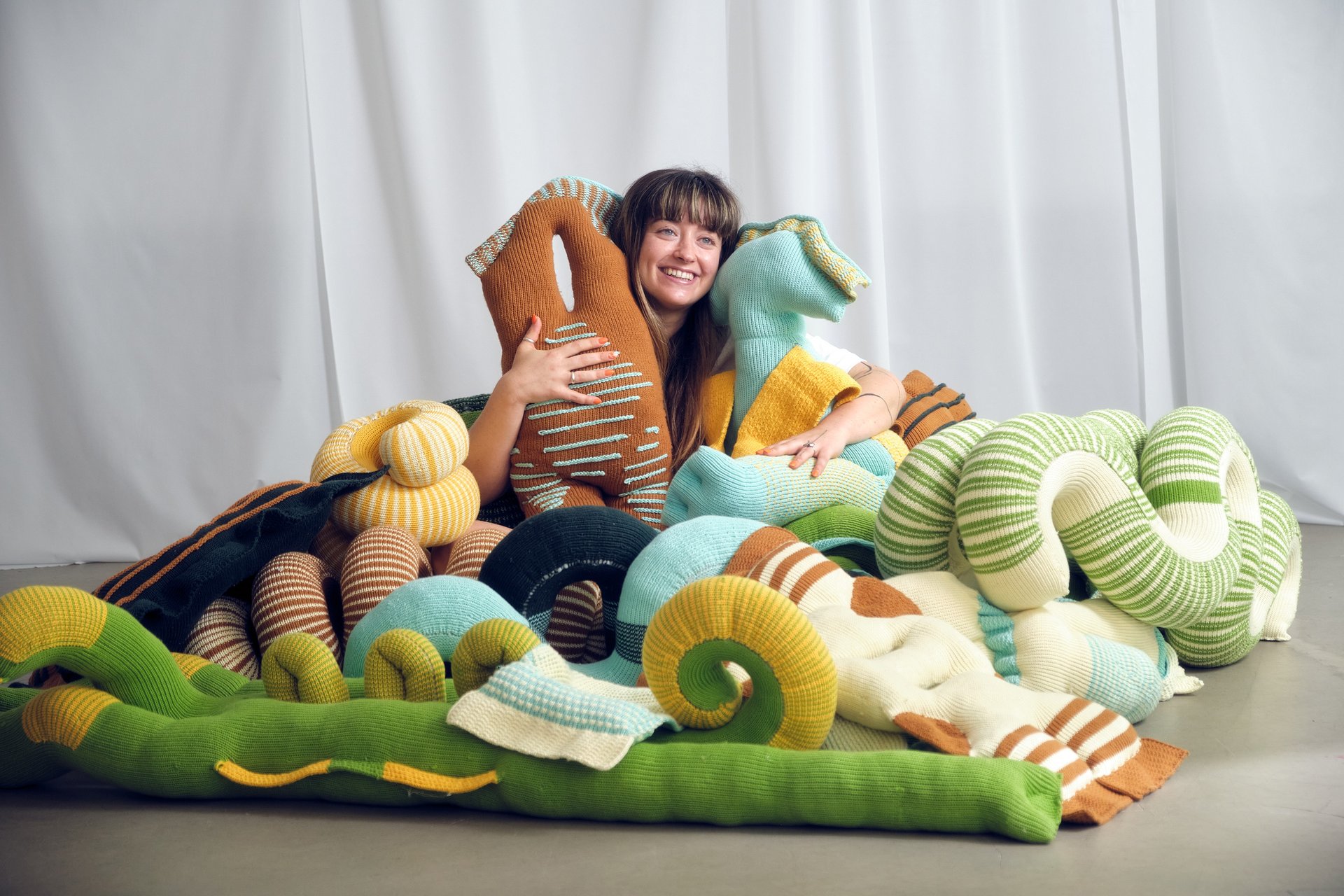 person wearing grey knit sweater