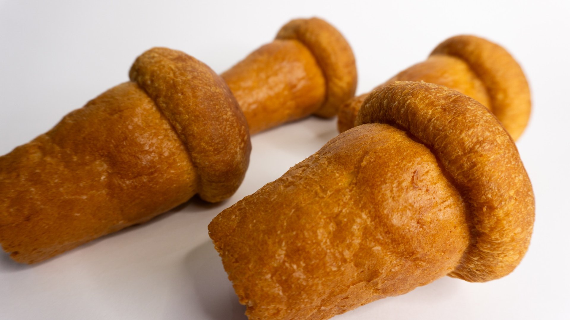 woman wearing yellow long-sleeved dress under white clouds and blue sky during daytime