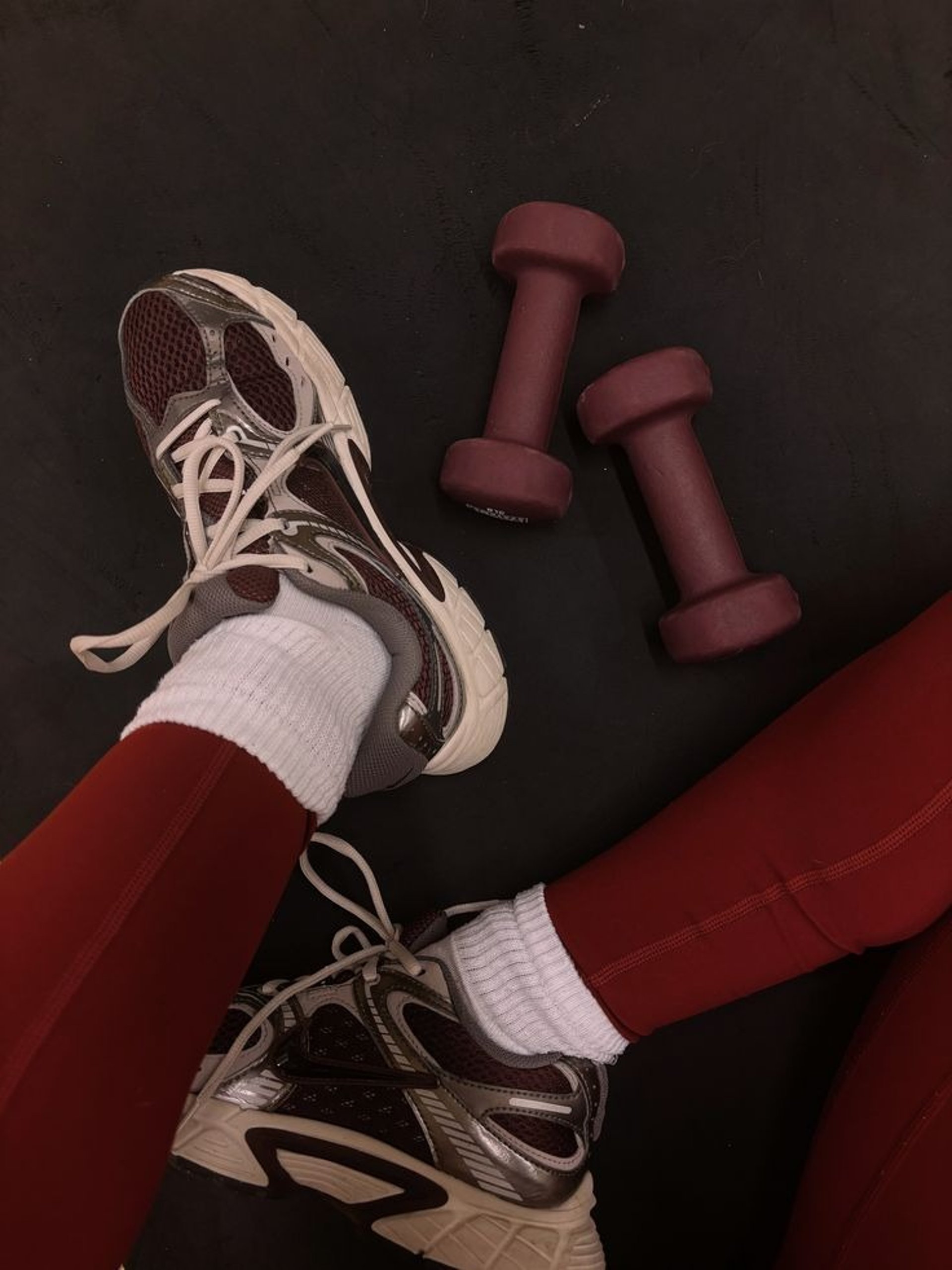 pink dumbbell on pink textile