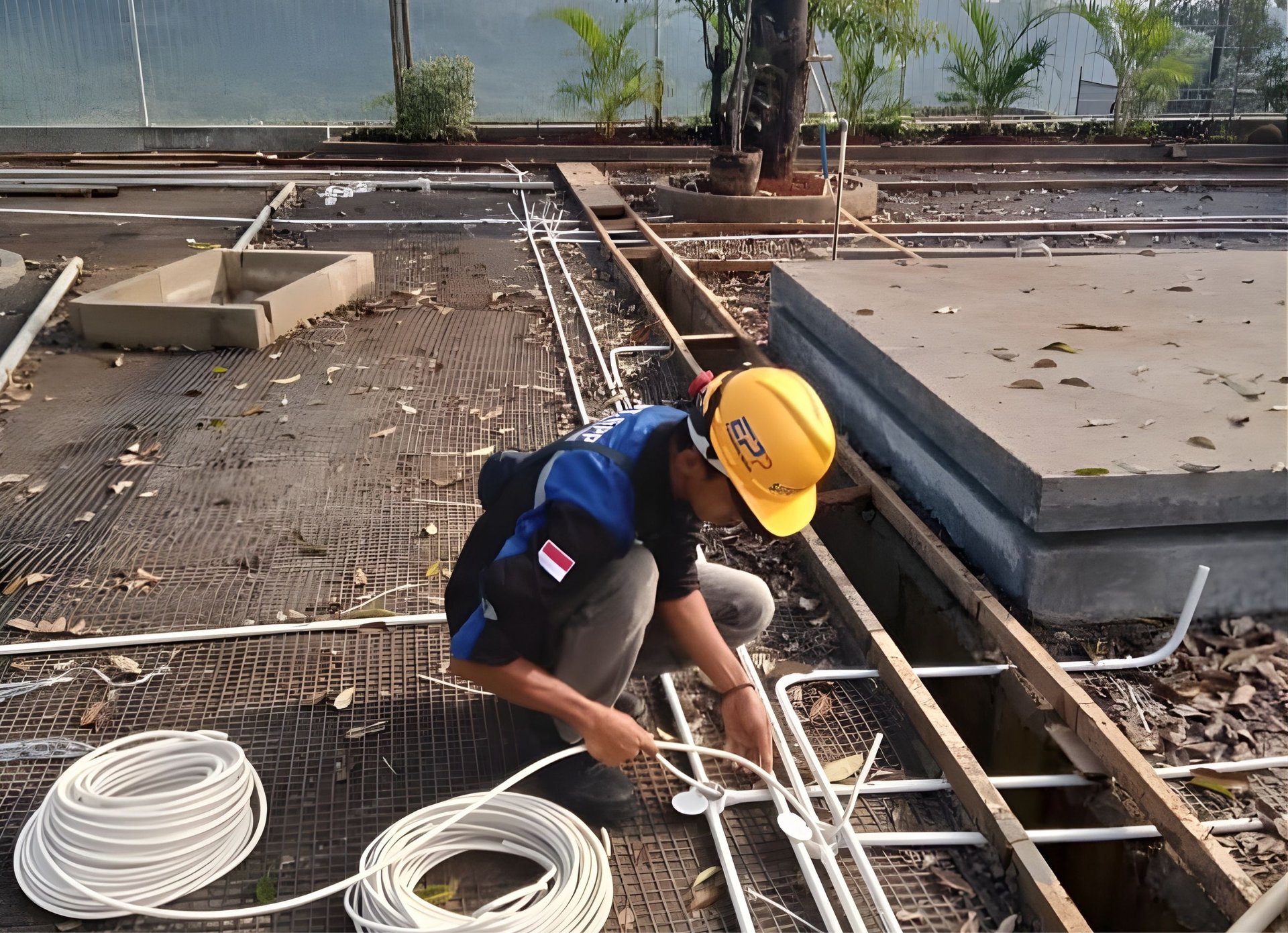 man in red jacket and black pants walking on gray concrete stairs