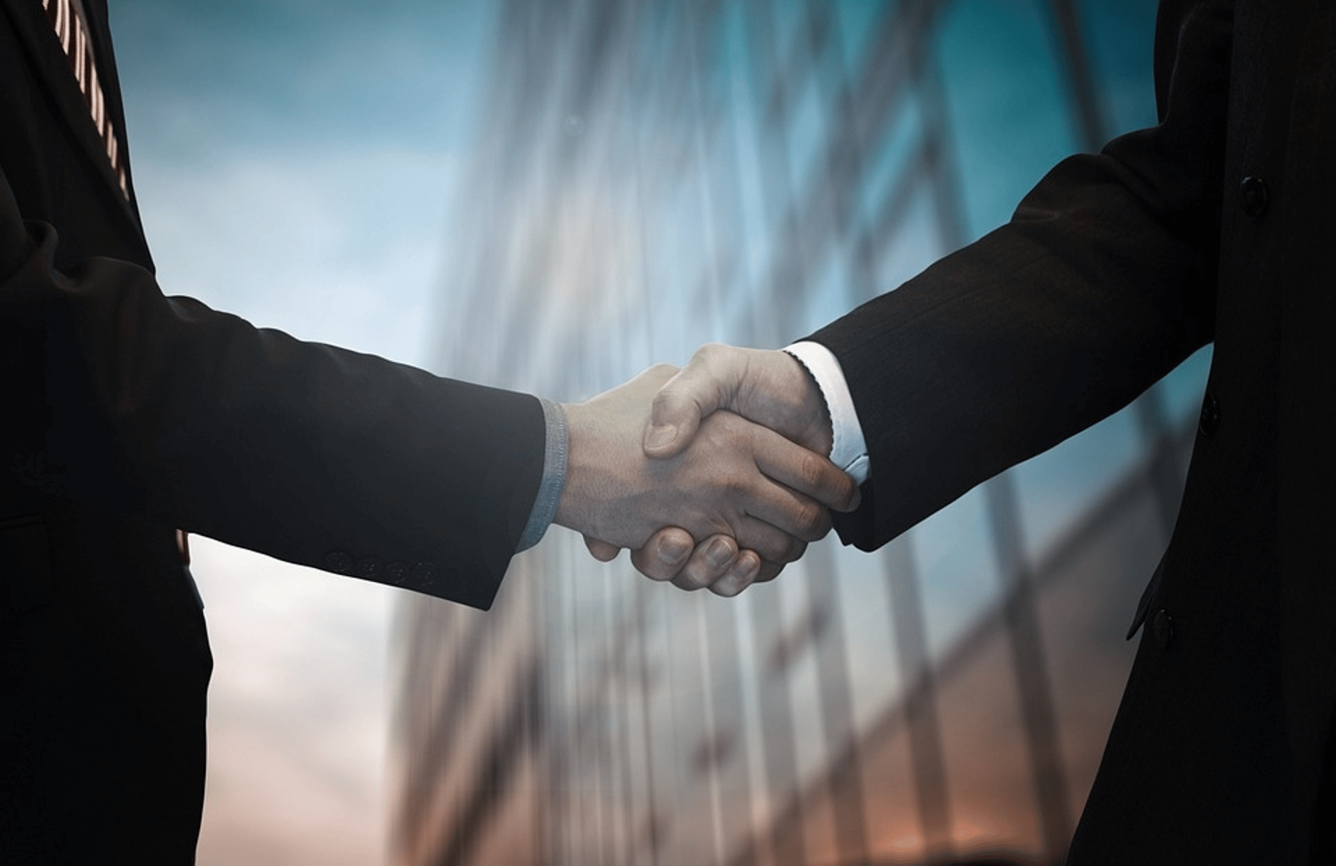 Modern office with desks, chairs, and a presentation screen.