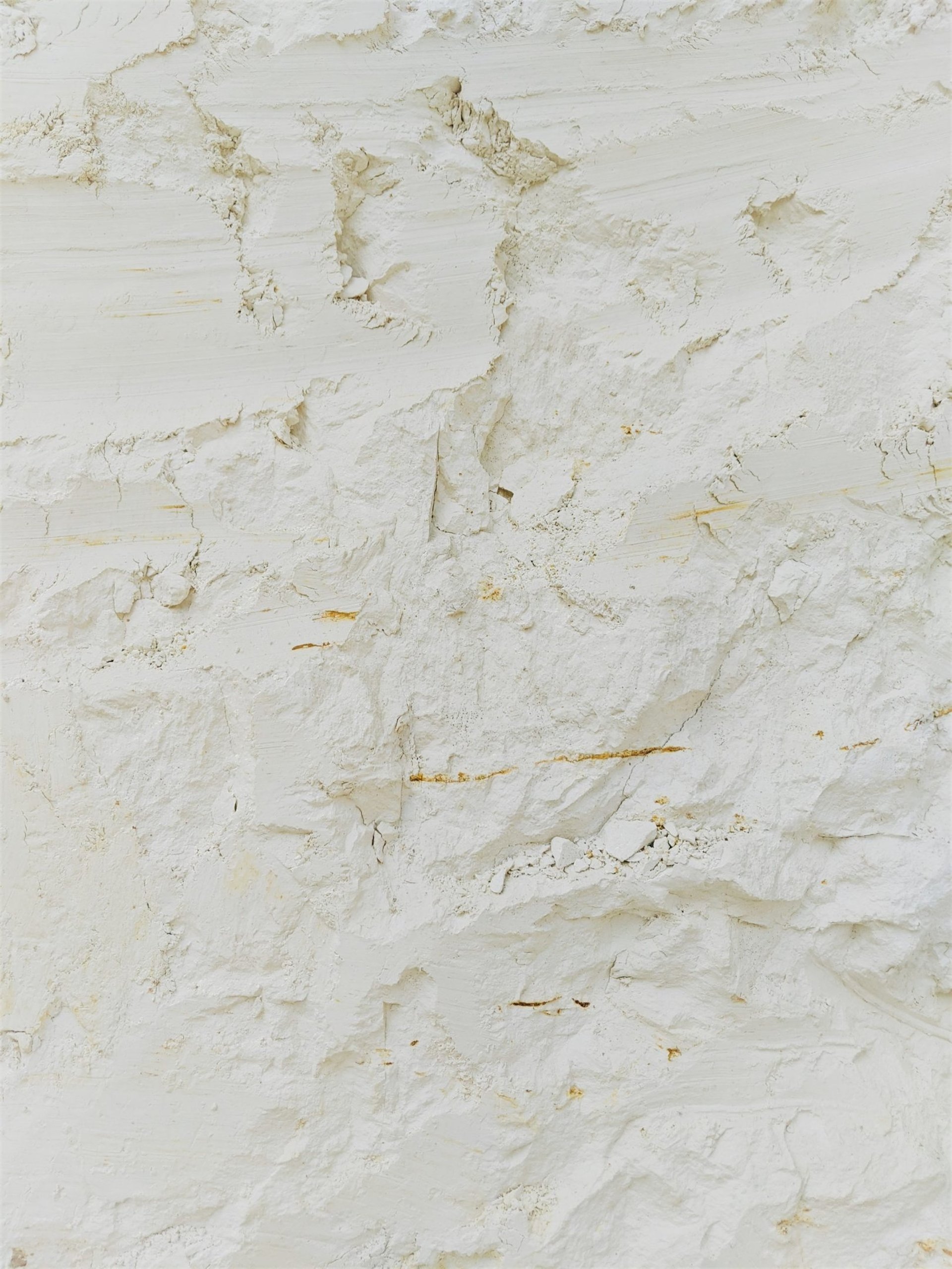 an abstract photo of a curved building with a blue sky in the background