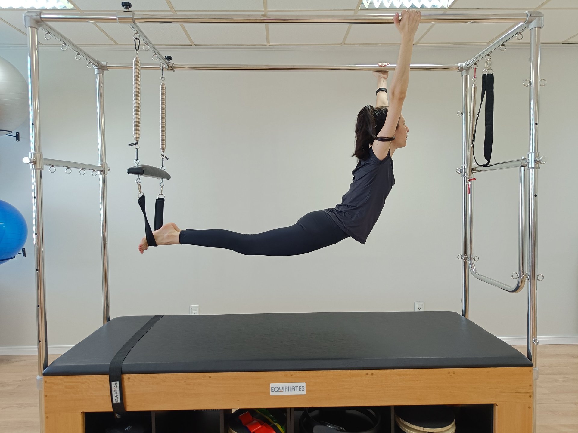 a woman doing a handstand on a pivot exercise
