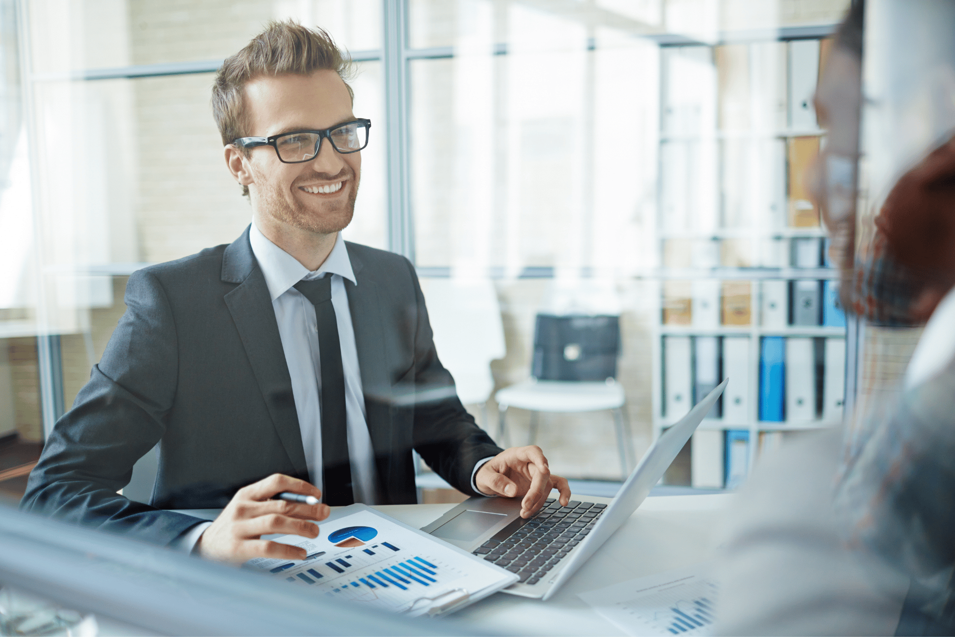an abstract photo of a curved building with a blue sky in the background