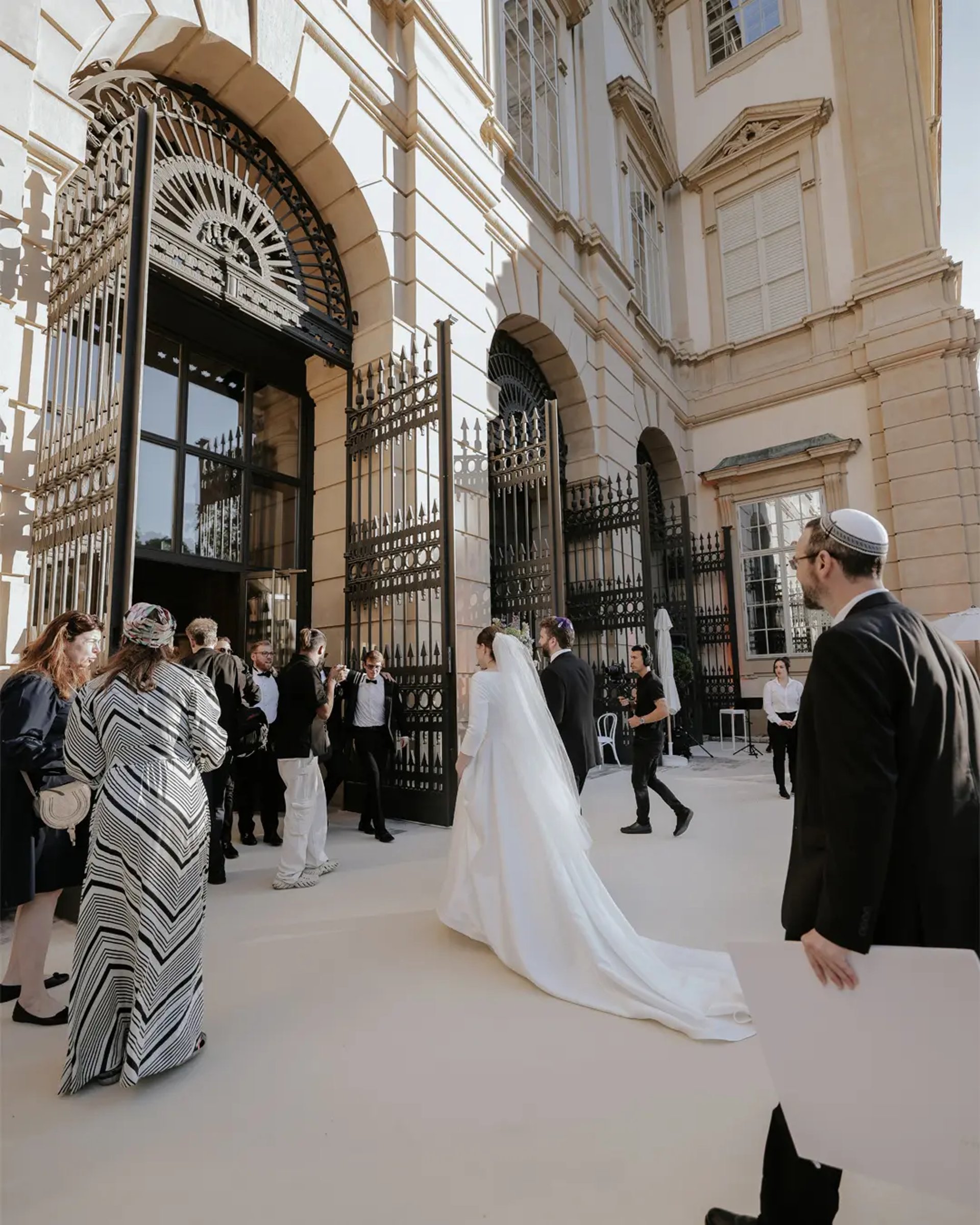 an abstract photo of a curved building with a blue sky in the background