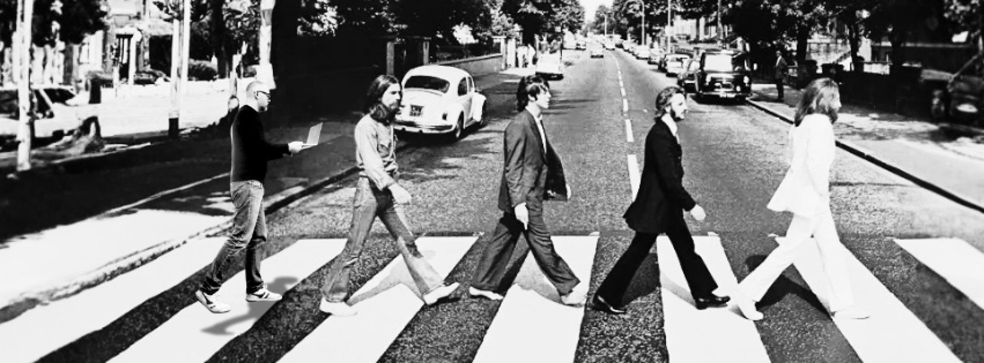 person writing on brown wooden table near white ceramic mug