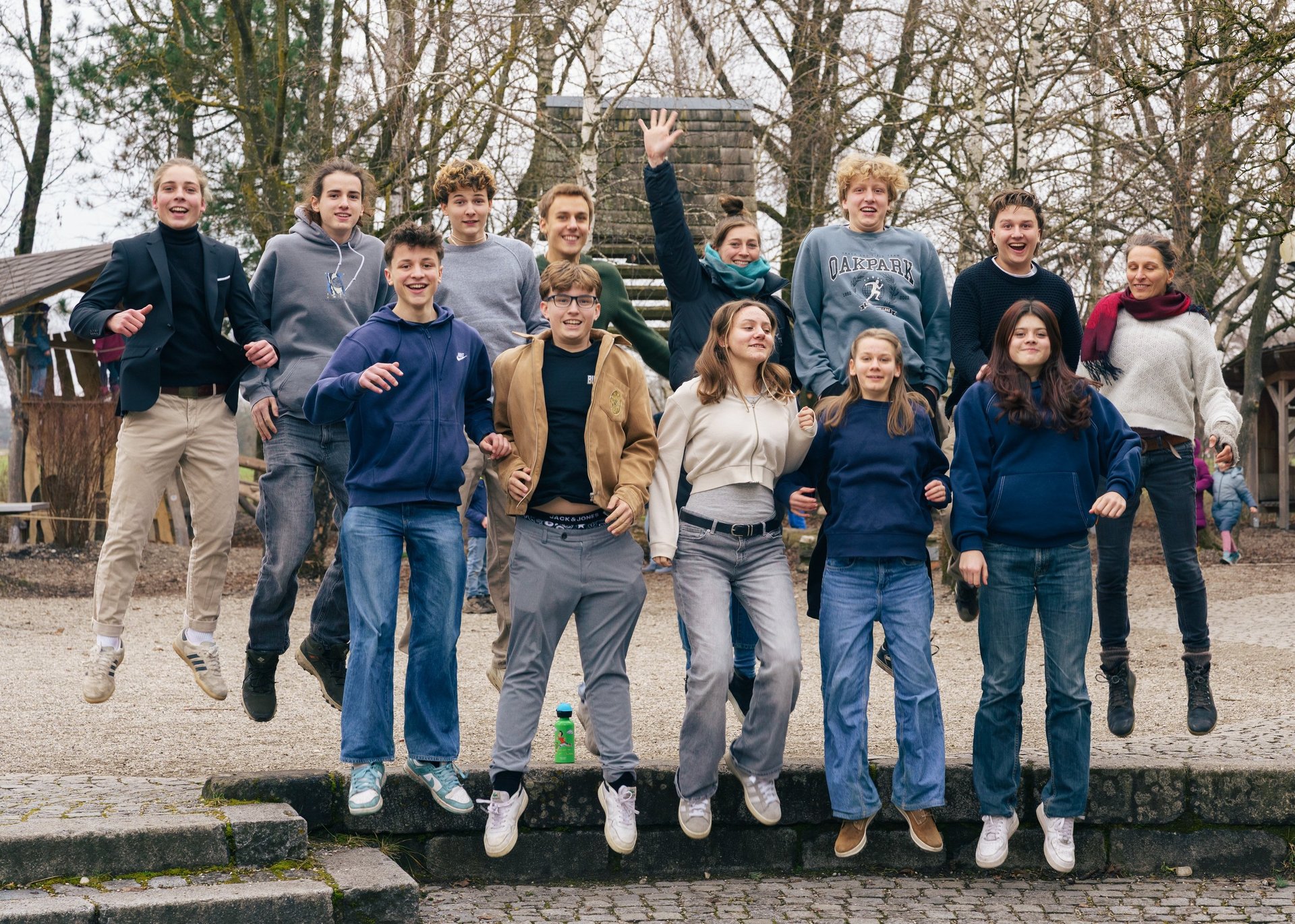 group of people standing on brown field near snow covered mountain during daytime