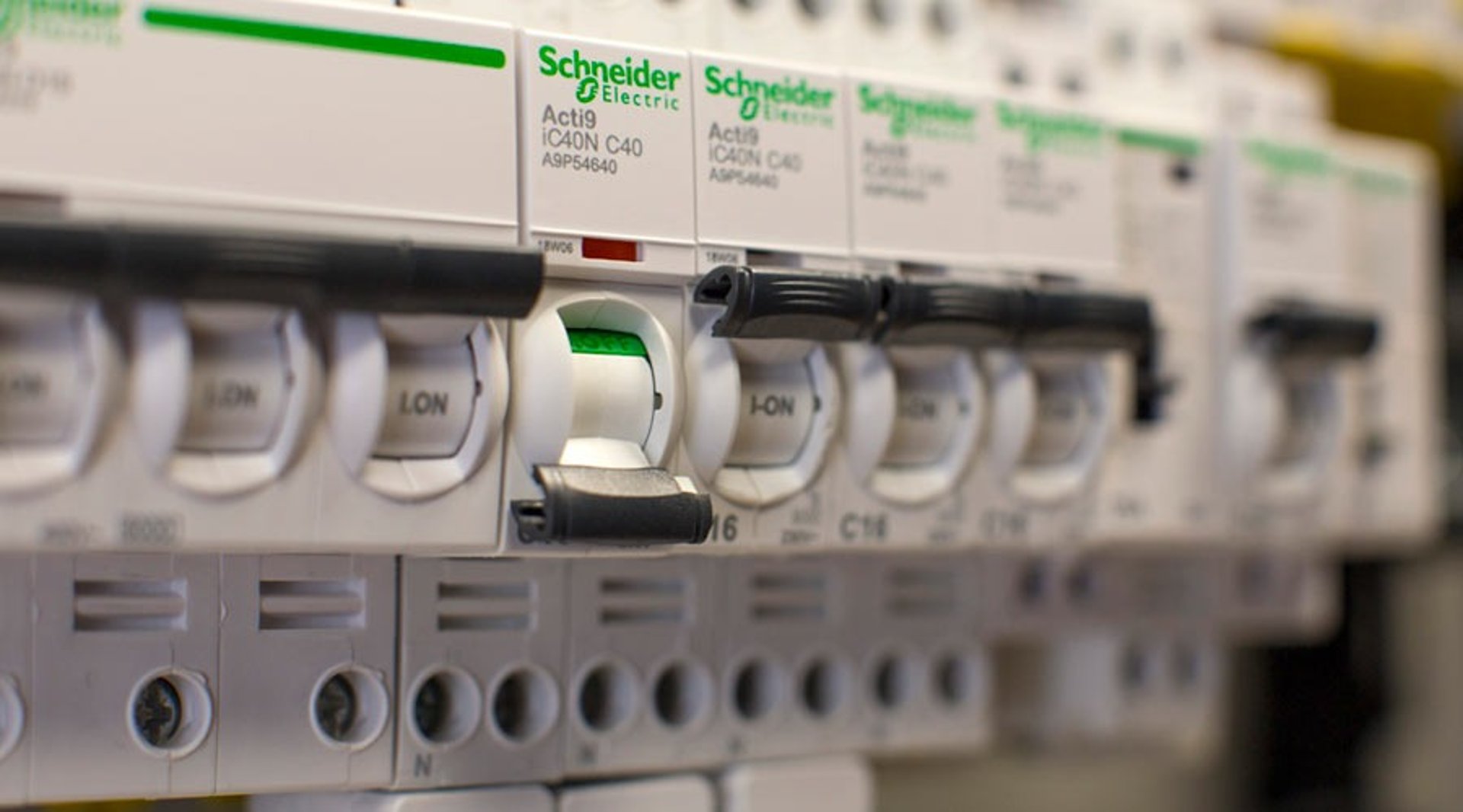 an abstract photo of a curved building with a blue sky in the background