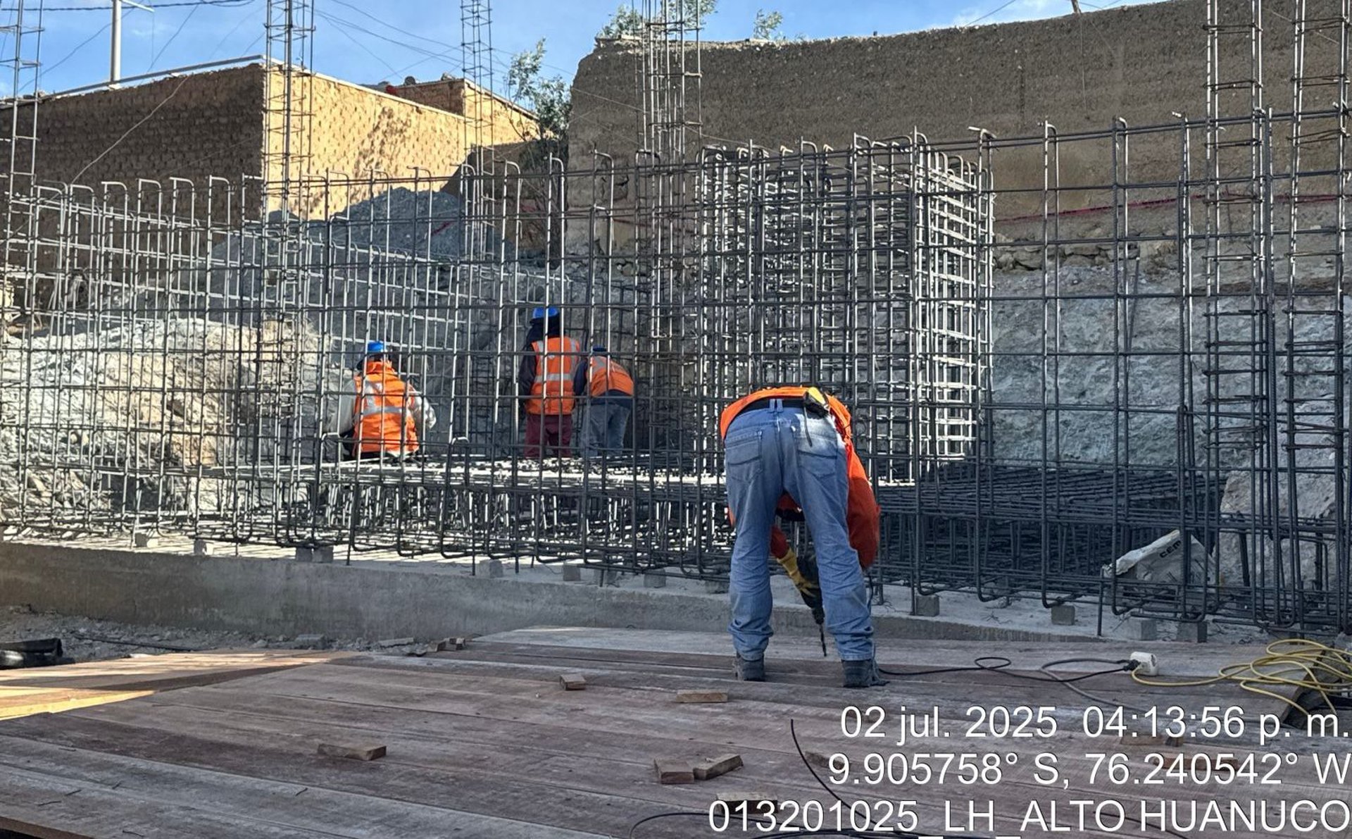 an abstract photo of a curved building with a blue sky in the background