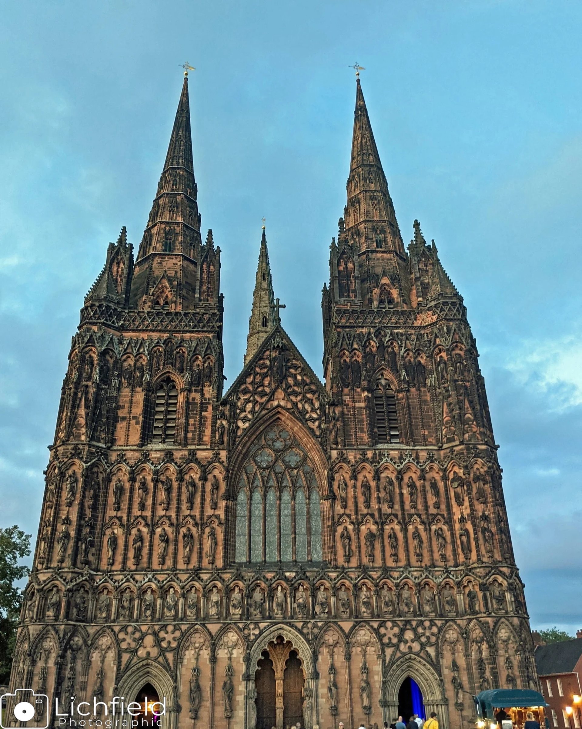 Lichfield Cathedral against a blue sky