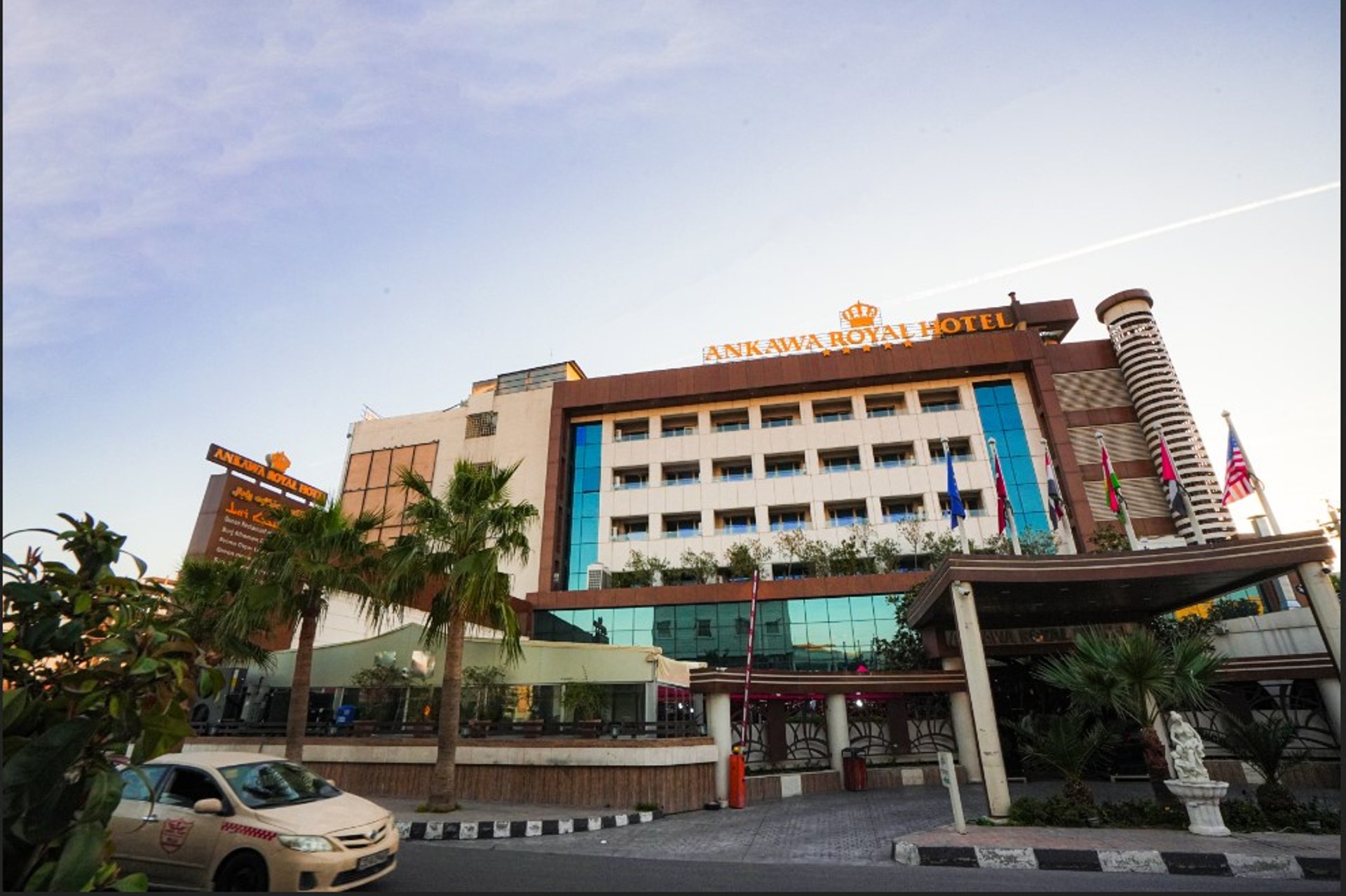 black and white bed near brown wooden table