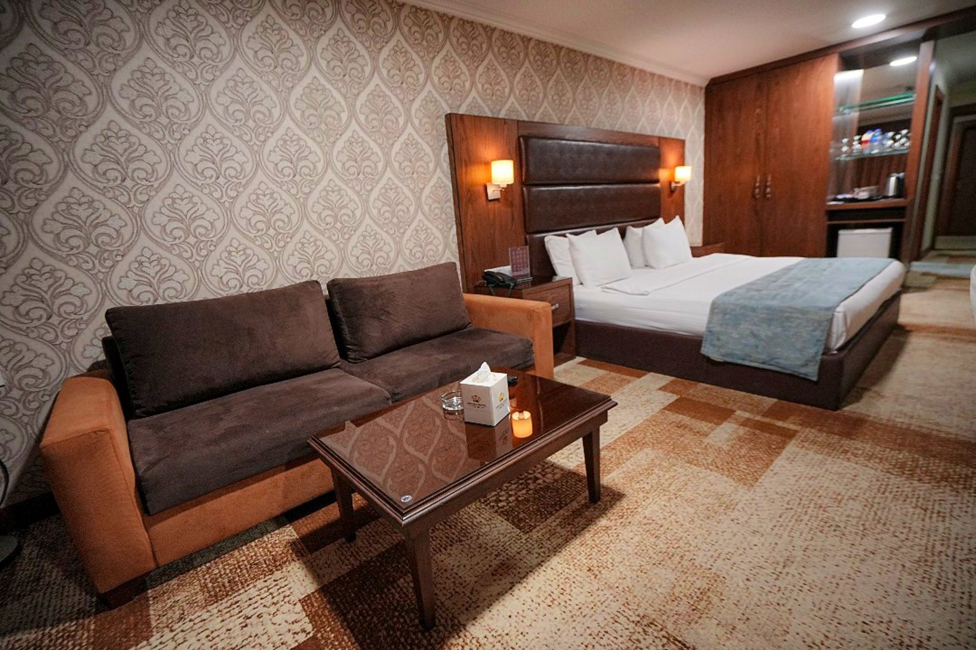 white bed linen with throw pillows