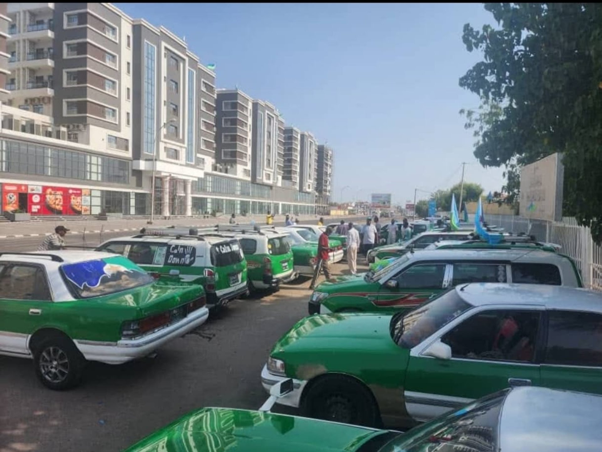 woman wearing yellow long-sleeved dress under white clouds and blue sky during daytime