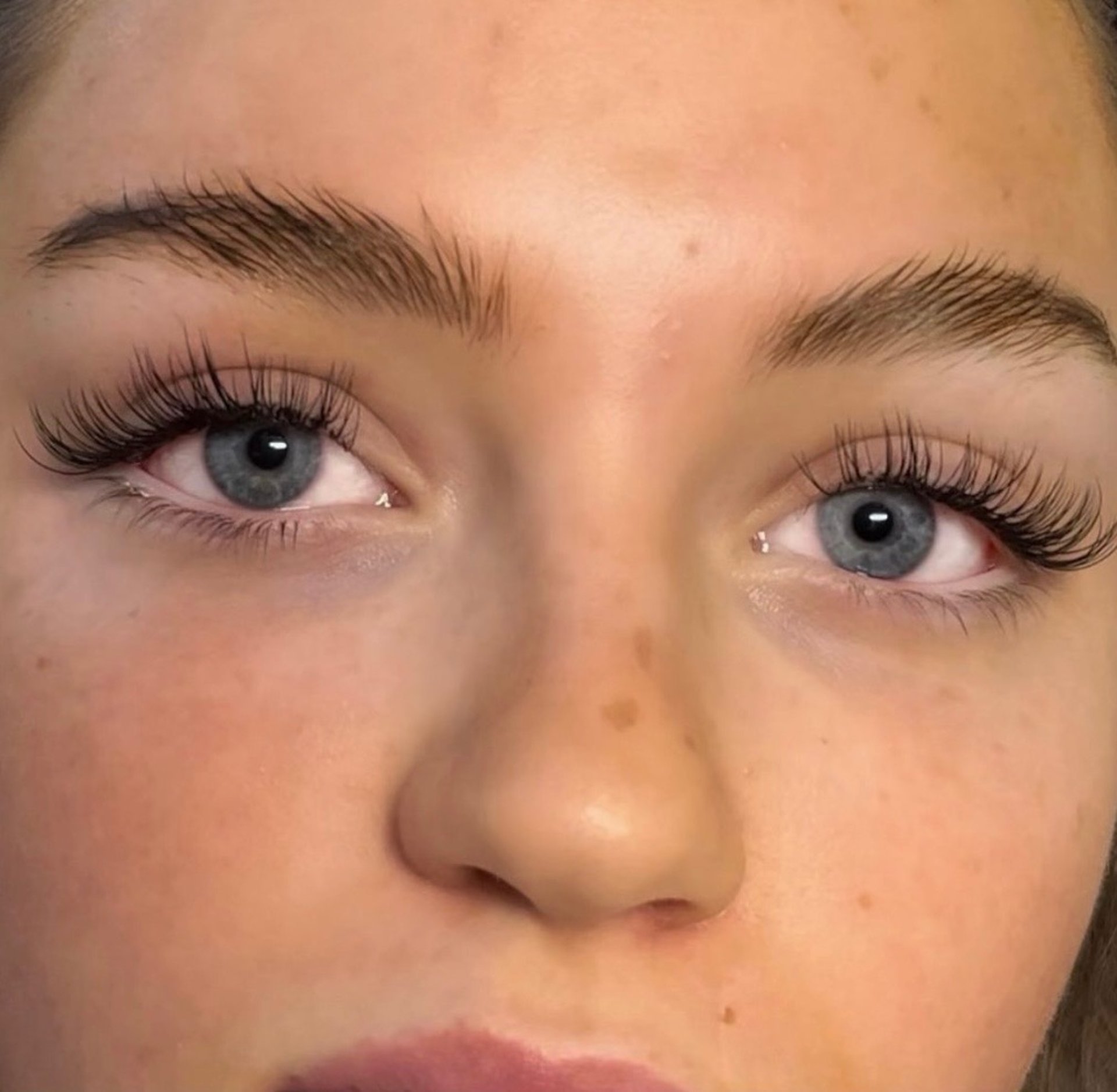 an abstract photo of a curved building with a blue sky in the background