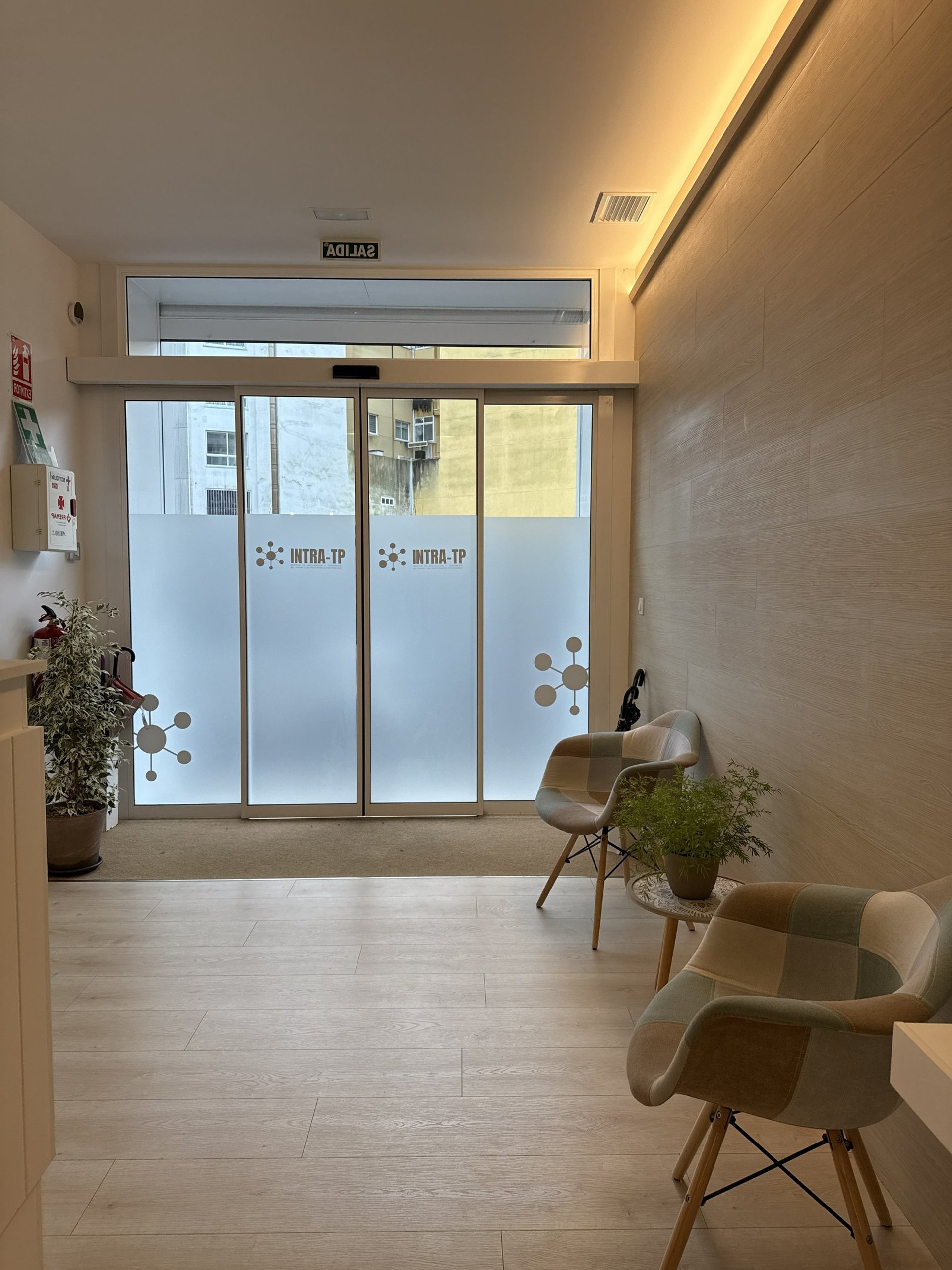 hallway between glass-panel doors